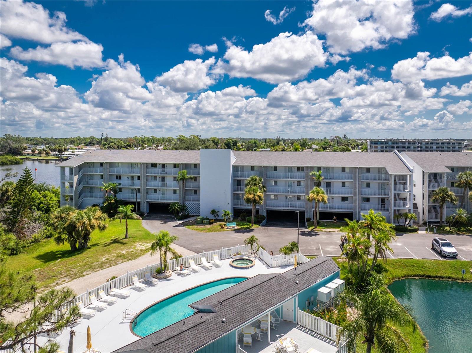 Have you been dreaming of your Florida escape? Make this updated condo yours! Located in the gated community of Lemon Bay Breezes with available boat dockage on Gottfried Creek, leading out to Lemon Bay and the Gulf of America, a heated community pool and spa, tennis courts, kayak racks, boat ramp, designated parking spaces in the garage, secure storage and an elevator. This condo is situated on the first floor with exquisite water views. There is plenty of room to spread out and enjoy the Florida lifestyle. Share a meal with friends in the light filled dining room with a pass through from the updated kitchen complete with solid wood cabinets, granite countertops, tile backsplash and stainless steel appliances. The expansive living room is open to the kitchen with sliding glass doors extending out to the lanai. Enjoy a cup of coffee while watching the sunrise in the all weather covered, screened and slider enclosed lanai. The primary bedroom offers access to the lanai, an oversized walk-in closet and beautifully updated en suite bathroom. Visitors will enjoy their stay in their own private room with an en suite bathroom. There is a laundry closet and additional custom built in storage off the kitchen. No carpet to replace here! All tile and luxury vinyl plank flooring throughout. Less than 2 miles to Englewood Beach, exceptional locally owned dining, boat and water sport rentals, weekly farmers markets on Dearborn Street, live music and nightlife all just minutes away. Just bring your suitcases!