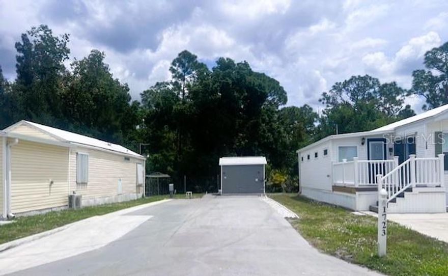 VACANT LOT IN DESIRABLE ALLIGATOR PARK – OWN YOUR LAND! Ready for your RV, travel trailer, or a new manufactured home, this 30' x 80' vacant lot is located toward the back of the park and backs up to a wooded area, offering added privacy and a peaceful setting.

The property includes a 10x10 shed equipped with a full-size washer and dryer, plus 30/50 amp electric service and water/sewer hookups, making it ideal for immediate RV use or future home placement.

Located in Alligator Park, a welcoming 55+ resident-owned co-op community in Punta Gorda, this sale includes the co-op share, deeded with the property—a rare and valuable opportunity. No lot rent—own your own land!

Residents enjoy a wide range of amenities, including a community clubhouse, library, laundry facilities, shuffleboard courts, mailbox area, golf-cart-friendly streets, and pet-friendly spaces. The community also features a scenic 34-acre lake for catch-and-release fishing and non-motorized watercraft, along with an active social calendar offering something for everyone.

The low monthly HOA fee covers water, sewer, trash, lawn care, and full access to all community amenities, providing an affordable, low-maintenance lifestyle.

Conveniently located near Punta Gorda Airport (served by Allegiant Airlines), downtown Punta Gorda, waterfront parks, dining, shopping, and more. This vacant lot presents an excellent opportunity to enjoy relaxed Florida living in a friendly, active community.