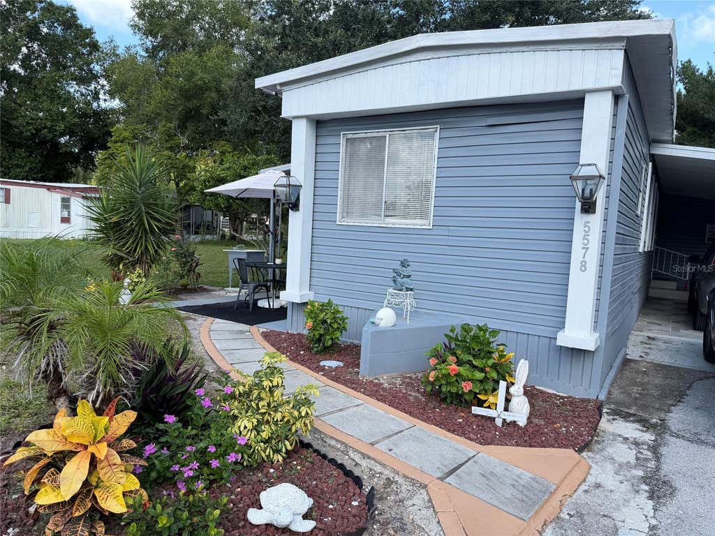 Photo of 5578 Denise Ave, Orlando, FL 32810 (MLS # O6436568)