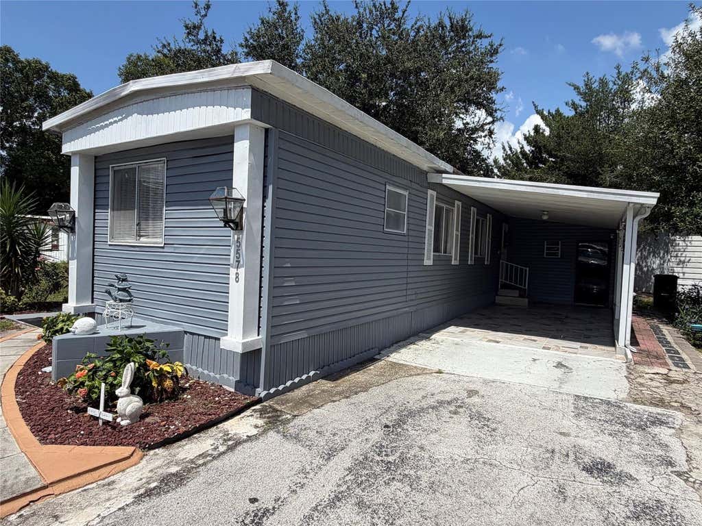 Photo of 5578 Denise Ave, Orlando, FL 32810 (MLS # O6436568)
