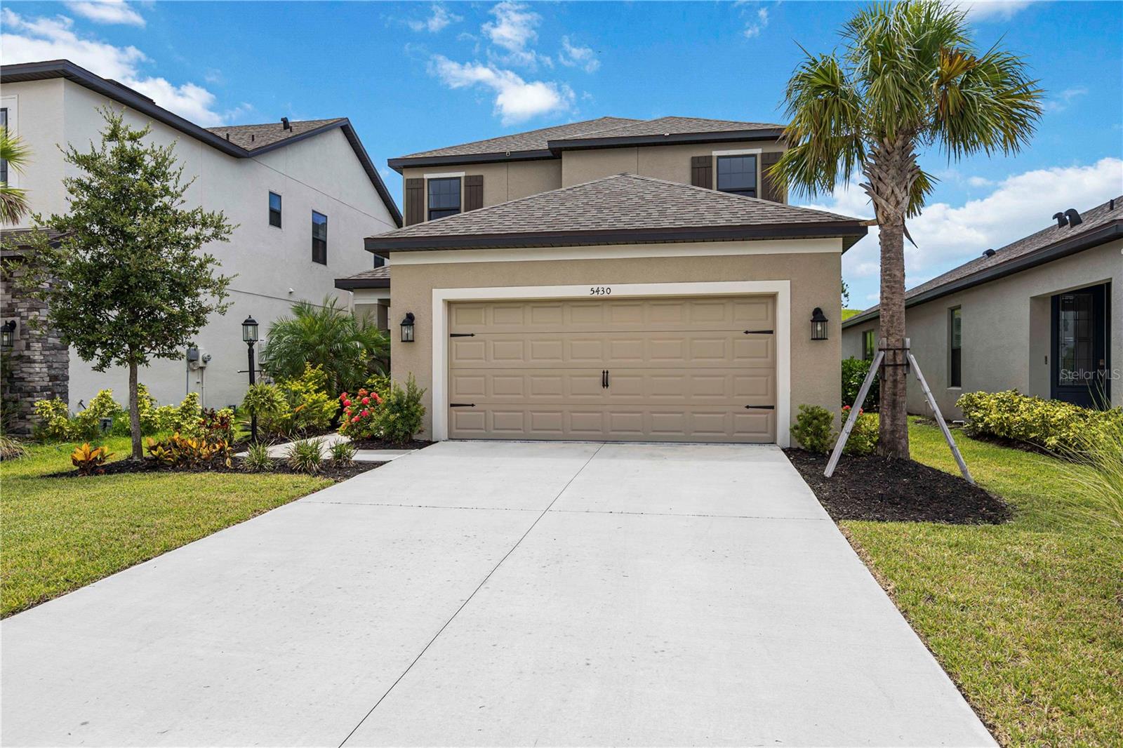 Discover this beautifully designed two-story home! This thoughtfully designed 4-bedroom home also features a versatile bonus room and a dedicated office, offering ample space for growing families, multi-generational living, or work-from-home needs. The open layout and additional living areas make this home perfect for both everyday comfort and entertaining guests. Built in 2022, located in the sought-after gated community of Grandview at The Heights. Offering nearly 3,000 square feet of well-appointed living space. From the moment you enter, you’ll appreciate the thoughtful design and elegant touches throughout. The expansive great room highlights an open-concept layout and an effortless flow ideal for both entertaining and everyday life. At the heart of the home is a gourmet kitchen with Quartz countertops, a custom tile backsplash, and stainless steel appliances—all crafted for function and style. Enjoy stunning views from the main living areas and the luxurious first-floor primary suite, which includes a generous walk-in closet and a spa-inspired ensuite bath with dual vanities and a walk-in shower. Also on the main level is a private den, ideal for a home office or quiet retreat. Upstairs, you’ll find a guest suite with a private full bath, two additional bedrooms, a full bathroom, and a spacious loft—perfect for a media room, play area, or additional workspace. The large bonus room can serve as a fifth bedroom or flexible living space to suit your lifestyle. Step outside to a screened lanai, where you’ll enjoy direct access to the scenic elevated trail park. The setting offers peaceful views and the perfect backdrop for relaxing or hosting gatherings. Residents of Grandview at The Heights enjoy exclusive access to a wide range of community amenities, including a resort-style pool, cabana, BBQ area, basketball court, kayak launch on Ward Lake, fitness stations, pet park, and miles of walking trails surrounded by lush greenery. Located close to top-rated schools, shopping, dining, entertainment, beaches, and medical facilities, this exceptional home offers the perfect combination of comfort, convenience, and community living. Don’t miss your opportunity to call this remarkable property your own!