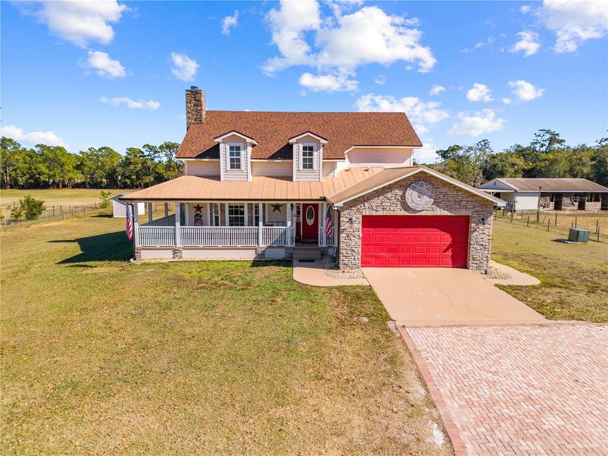 Welcome to your private slice of country living with all the conveniences of town! This stunning 4-bedroom 2.5-bath pool home sits on 4.8 of beautifully fenced and cross-fenced acres in the desirable St. Cloud Manor neighborhood. Offering three separate pastures, a center aisle 6 stall barn with electric, water, and tack/feed room, plus an impressive 50x50 shop complete with water, electric, and 30 & 50 amp service perfect for your RV. The home welcomes you with a charming wrap around front porch that flows into the screened in pool area ideal for relaxing or entertaining. New roof installed last year giving you peace of mind for years to come. You can even enjoy rocket launches from the backyard! Inside, enjoy soaring ceilings, a cozy wood-burning fireplace and new flooring throughout the home. There is a  spacious kitchen with lots of natural lighting that features granite countertops, new stainless steel appliances, and a stunning view of the pool area and backyard. The primary suite is conveniently located downstairs and boasts a recently remodeled ensuite bath with dual sinks, walk-in shower, jacuzzi soaking tub, and dual closets. With NO HOA and close proximity to shopping, restaurants, schools, and everything growing St. Cloud has to offer this property delivers the perfect blend of space, function, and lifestyle. Bring your animals (big and small), your toys, and your dreams. Buyer and/or buyers agent responsible for verifying any/all information.