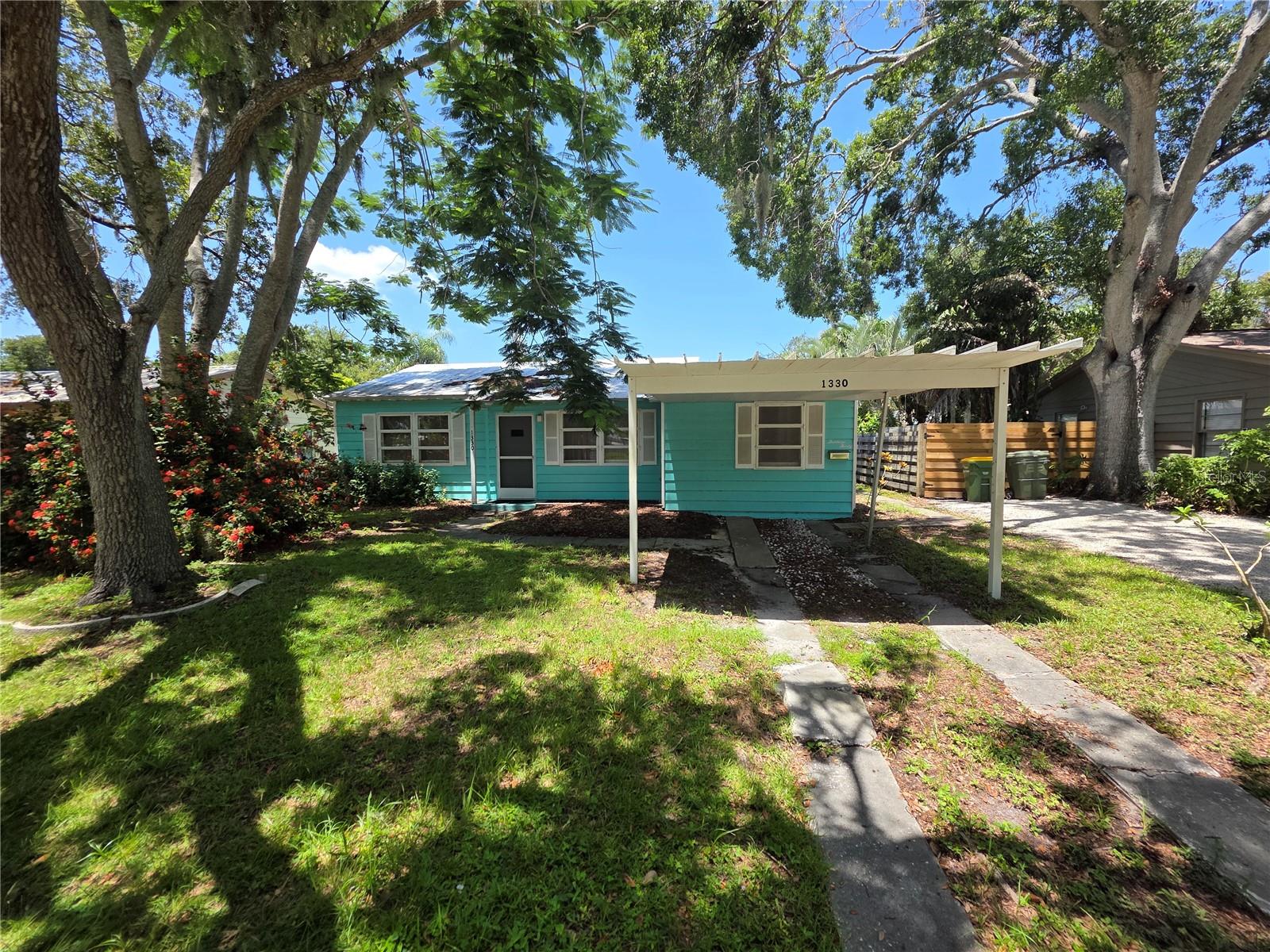 This is the One! *Rarely available opportunity just a short walk or bike ride to World Famous Pinecraft*This well-maintained 3 bedroom, 2 bath home features a durable metal roof and a sparkling inground pool with a screened-in lanai—perfect for relaxing or entertaining year-round*