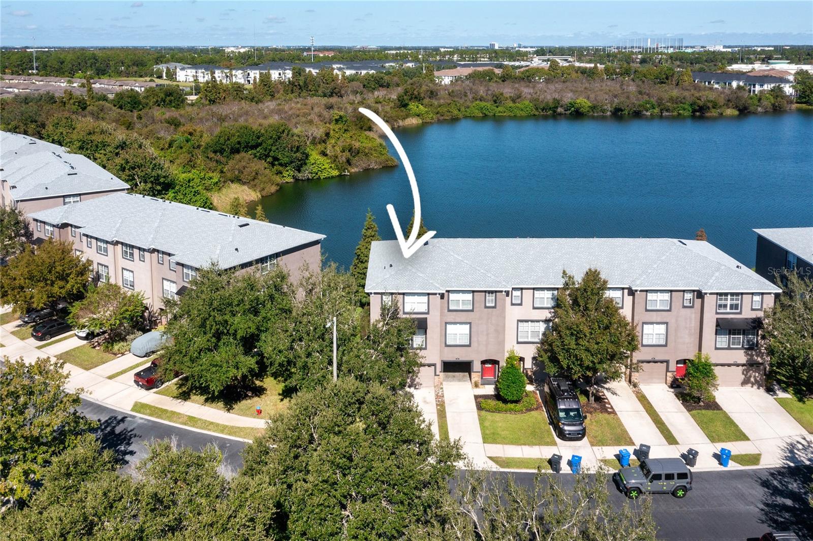 One or more photo(s) has been virtually staged. Wake up to sparkling lake views every day! This 3-bedroom, 3.5-bath townhome with a 2-car garage is designed for easy living and relaxed Florida vibes. Enjoy beautiful waterfront views right from your first-floor bedroom, kitchen, and master suite — the perfect backdrop for morning coffee or a night cap. 
The unique layout offers a private first-floor bedroom with a full bath, ideal for guests or a quiet home office. Upstairs, the spacious second floor welcomes you with an open-concept kitchen featuring wood cabinets, a breakfast bar, and a bright dining area that flows seamlessly into a generous family room, perfect for entertaining or cozy nights in. The third floor offers two additional bedrooms, each with access to a full bath, plus a convenient laundry room and open landing area.
Nestled in a gated community with a sparkling pool, this home offers a low-maintenance lifestyle. The HOA covers water, sewer, trash, lawn care, exterior maintenance, and even the roof! Located just minutes from Costco, shops, and dining, you’ll love the convenience as much as the view. Relax, unwind, and live lakeside. Your Brandon retreat is waiting!