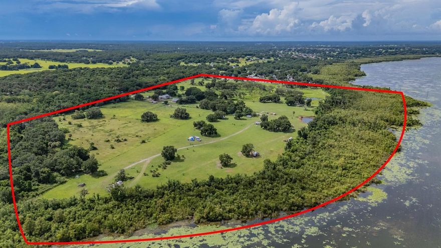 Endless opportunities for development with this Income producing 147 acres. Completely fenced with 3000 ft on beautiful lake Griffin, part of the Harris chain of lakes!  Two separate entrances for private and patron use.  
 
Minutes from The Villages. Centrally located from Ocala and Orlando.  Land previously planned for senior living, is ripe for housing and commercial development. Property can be zoned for commercial usage. 

Currently has active vacation camp site rentals. Including three 30 amp RV hookups and 1 sewage. 
Able to add 40 more RV hookup sites or tiny homes. 

Large stable with two efficiency apartments currently rented monthly. Horse boarding with 20 horses on land for monthly income.  Can build equestrian arena and RV hookups for events

Large pavilion with stage for hosting concerts, weddings, farmers markets and events.  No permit needed thanks to membership in Florida Agritourism Association. 

3000 ft of lake Griffin frontage access to Harris chain of lakes with boat ramp.  Recently cleaned and dredged for deep water access.  Can put income producing boat slip rentals.  With boat storage being in high demand in the area, there is plenty of room to add boat slips or even a dry dock facility.  

Finally, Gorgeous 3 bedroom 2 bath home with over 2500 sqft of open living space.  Vaulted ceilings, real wood floors and flawless touches.  Over sized bedrooms with walk in closets.  Updated Appliances with wine cooler and real wood cabinets.  Fully furnished Tack room with kitchenette, bathroom and plenty of space to relax.  

For additional details please visit the website.
https://lazykranchsouth/
“A piece of Heaven in Central Florida…”