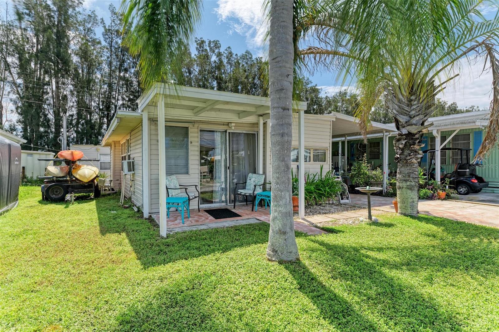 Completely renovated from top to bottom, this charming and affordable home is just 1.5 miles from Bradenton Beach and within walking or biking distance to the historic Cortez fishing village. The sellers have replaced the walls, flooring, electrical, appliances, cabinets, bathroom fixtures and raised the H2O heater to well above safety level and upgraded the outdoor ‘barn’ with new AC, flooring and walls. Outside you’ll find a large private back yard. Sunny Shores Community offers land-owned lots and short walk to Sunny Shores Park (waterfront, grilling, kayaking, etc). Boaters and fishermen will enjoy Parrot Cove Marina and boat ramp tucked away at the end of the community and plenty of room to park your boat next to the home too. Adorable one-bedroom bungalow is offered completely furnished in a coastal theme, sure to make your vacation home a pleasure to come back to after a long winter up north! There are TWO storage buildings on the property. The driveway shed is built as a 16 X 7 workshop with workbench and the backyard bungalow (approx 10 X 8)could be used for arts/crafts, office, workout room or spare sleeping space. Not to worry, you still have room to park your vehicle in the driveway and under roof. Quick access from Parrot Cove to the deep water of Palma Sola Bay opening to Anna Maria Sound and the Gulf of Mexico. The community offers an OPTIONAL annual $80 HOA fee to include planned events, shuffleboard and clubhouse. The location is perfectly situated within 1.5 miles to the the sandy beaches of Bradenton Beach and Longboat Key, Anna Maria Island, three airports, waterfront restaurants, shopping and so much more awaits you. Sellers have documented their rebuild, call today for more information or to see this hidden beauty.