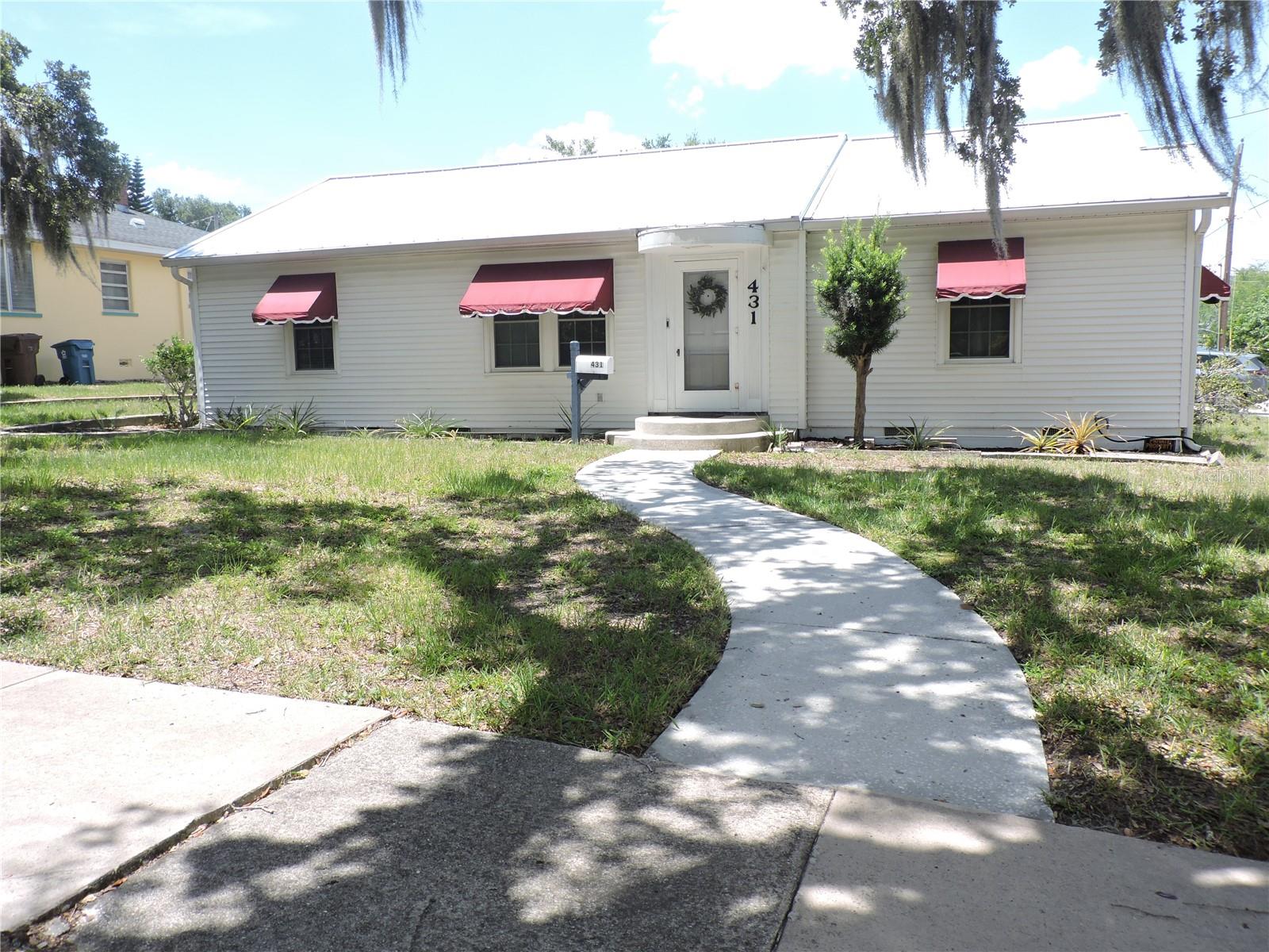 YOU WILL LOVE LIVING IN THE HISTORIC DOWNTOWN AREA OF LAKE WALES. JUST A SHORT WALK TO BEAUTIFUL LAKE WAILES LAKE AND THE PARK AREAS. THIS CHARMING OLDER HOME HAS SO MUCH TO OFFER WITH LOVELY HARDWOOD FLOORS, 3 SPACIOUS BEDROOMS, 2 BATHROOMS, A SPLIT FLOOR PLAN, A NICELY REMODELED KITCHEN AND A SMALL OFFICE SETTING. A LIGHT AND BRIGHT LIVING ROOM AND DINING COMBO, INSIDE LAUNDRY JUST OFF THE KITCHEN IN THE BREEZEWAY. A GOOD SIZE BONUS ROOM WITH MANY USES. THE HOME SITS ON A LARGE LOT WITH A DOUBLE GARAGE AND A METAL ROOF. THIS WELL-LOVED HOME CAN BE YOURS, SO DON'T DELAY CALL TODAY!!