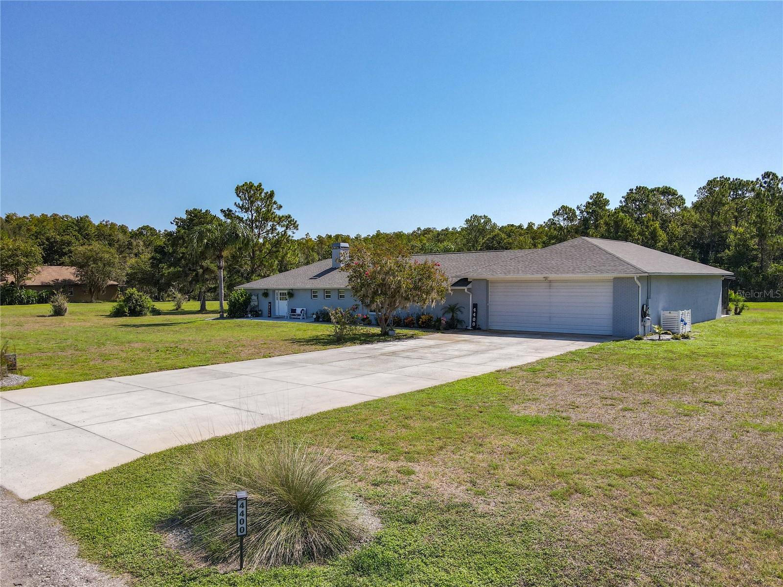 This spectacular home sits on 5.73 acres and offers just under 2,500 sq. ft. of living space, featuring three bedrooms, three full baths, and a half bath. Inside, you’ll find ceramic tile flooring throughout, spacious walk-in closets, and a cozy wood-burning fireplace in the living room. The home also includes a private office, an oversized laundry room with abundant storage, and a stunning primary suite complete with a large walk-in closet, a beautifully tiled shower with a rain shower head, dual vanities, and a linen closet. Completed numerous upgrades and remodeling projects between 2021 and 2025, including: New roof, EV charging station, exterior painting, new kitchen/cabinets/appliances, bathroom updates/new toilets-sinks-vanities, all new updated lighting through-out, new aluminum-fenced yard, enclosed lanai (29 x 14), Culligan whole-home chlorination system, new windows, new well drilled, new HVAC system, and new hot water tank. Septic pumped every 2 years, pest control done quarterly, and Ring security system with 4 external cameras included. Last but not least, an impressive 1,800 sq. ft. attached garage provides exceptional space for multiple vehicles, storage, or even a workshop. Complementing it is an oversized 30' x 80' driveway, offering ample room for parking.
Life in this area comes with a rare perk, an aviation-inspired lifestyle right at your doorstep. At Seminole Lake Gliderport, one of the busiest soaring locations in the country, you can easily take part in gliding or simply enjoy the show. From your porch, watch as gliders launch energetically and float effortlessly across the sky. The Gliderport itself has facilities like a clubhouse, a small cafe, and a swimming pool that homeowners can potentially utilize. The area surrounding the Glider Port provides many opportunities for outdoor activities, including walking, hiking, and enjoying the natural environment. There's also easy access to Lake Louisa State Park for camping, hiking, fishing, and kayaking. Clermont is a suburb of Orlando with great access to major roadways, making commutes to downtown Orlando and attractions like Disney and Universal relatively easy. Downtown Tampa is just over an hour commute. Airports within an hour. Call today for your private tour!