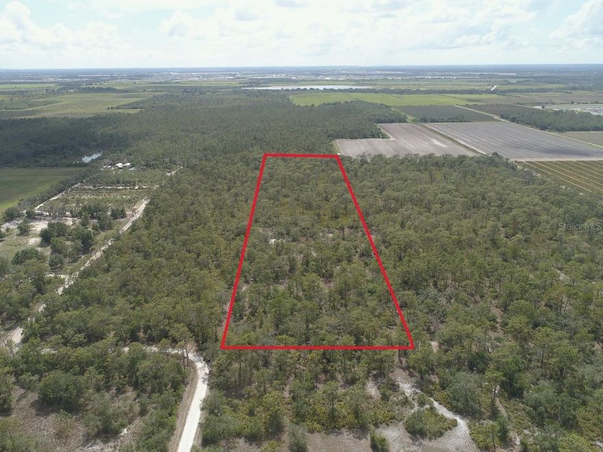This exquisite 10-acre plot of unoccupied land, nestled in the sun-soaked city of Bradenton, Florida, within the serene confines of Manatee County. Revel in the seclusion that comes with this expansive acreage, with attractions such as a charming winery and the picturesque Manatee Lake in close proximity. Embrace the rustic way of life, all while being mere minutes away from a plethora of shopping and recreational activities.