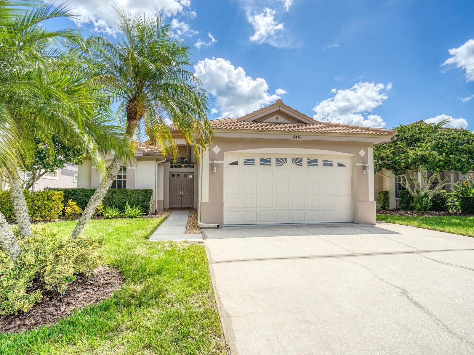 Welcome to this 3 bedroom 3 bath single family home in the only maintenance free community of Lansbrook in Palm Harbor! The formal hall leads to a light and airy living room/dining room combination with high ceilings and tasteful contemporary details. These spaces are amplified by the glass sliding doors which open onto a soaring lanai with golf course views and a pond beyond. The kitchen is easily accessible from two directions and has cinnamon maple cabinets, breakfast bar and stainless steel appliances. Just off the kitchen is a breakfast area with panoramic views of the lanai and green spaces beyond. The primary suite has generous his and hers walk-in closets and en suite bath with shower, garden tub, double vanity and private commode. In addition to the spacious second and third bedrooms and 2 more full baths, there is a bonus room in the rear which is one more place to take in the amazing view! Your low monthly fees in Oakmont cover lawn and shrub maintenance, exterior painting, walkway and driveway power washing, trash and a community pool. Roof was replaced 2021, HVAC 2018, water heater 2024, appliances 5 years old. The oversized 33 feet deep garage and attic space above it are wonderful for added storage. Enjoy all the other amenities Lansbrook has to offer like miles of walking/bike trails, 2 parks, playgrounds, and community boat ramp to Lake Tarpon. In close proximity to shopping, restaurants, the Pinellas Trail extension and John Chesnut Park or a short drive to airports and our beautiful gulf beaches! This one is ready for you to make it your own!