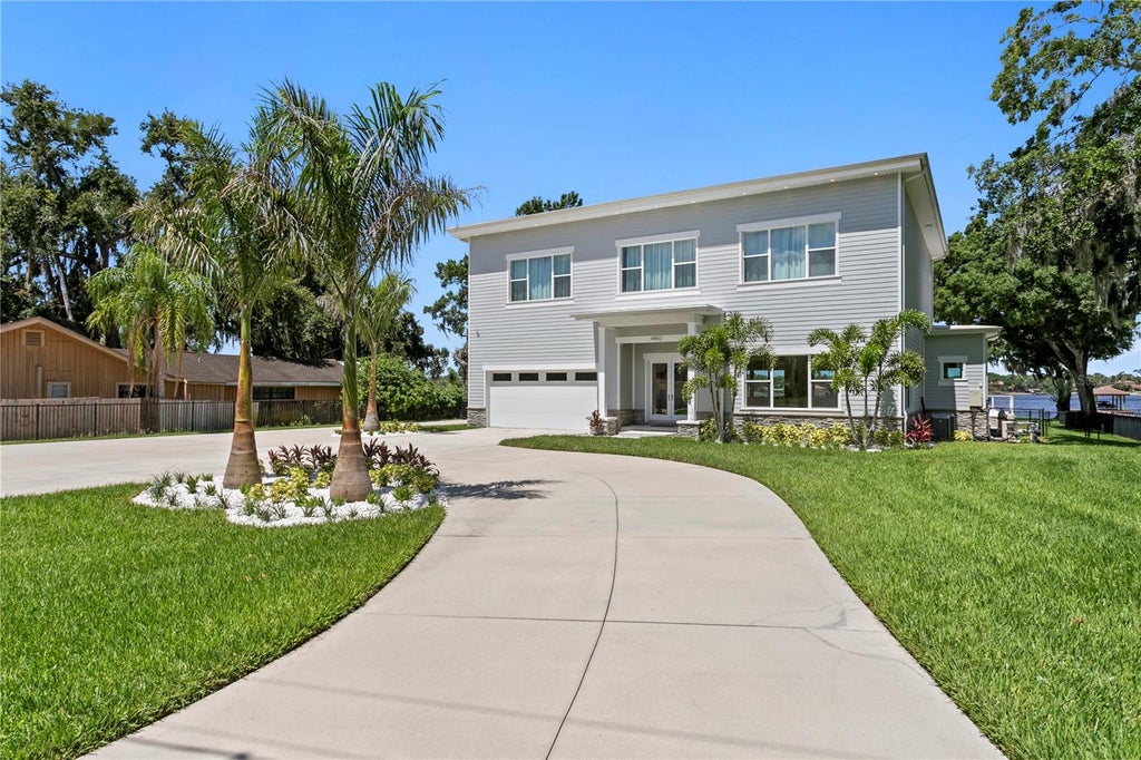 Photo of 14802 Lake Magdalene Circle, Tampa, FL 33613 (MLS # TB8519269)