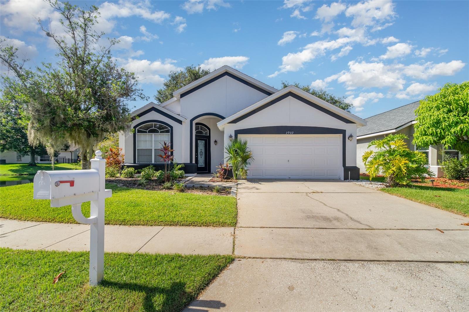 Beautiful waterfront home in desirable Remington Village! This well-maintained 3BR/2BA offers an open floor plan with vaulted ceilings, formal living/dining, and a spacious family room open to the kitchen and breakfast area. Sliding glass doors lead to a screened lanai with Italian slate tile and peaceful pond views. The kitchen features a large breakfast bar, ample counter space, and storage. The master suite boasts a walk-in closet and spa-like bath. Inside laundry, double-pane windows, 2-car garage, and wood laminate/tile flooring throughout. Conveniently located near UCF, top-rated schools, shopping, dining & major highways.