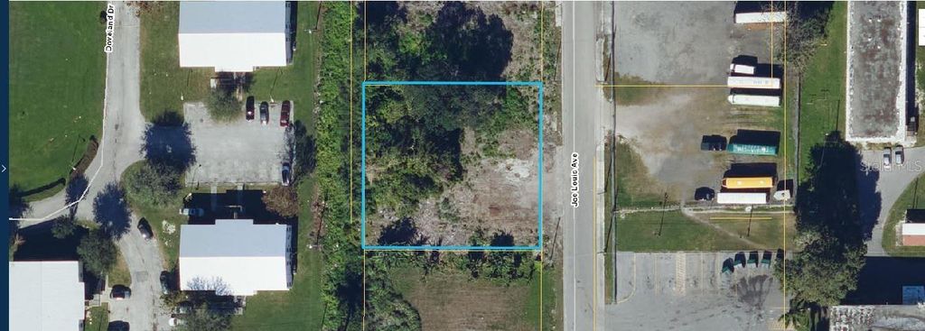 Photo of 875 Joe Louis Avenue, Pahokee, FL 33476 (MLS # O6357707)