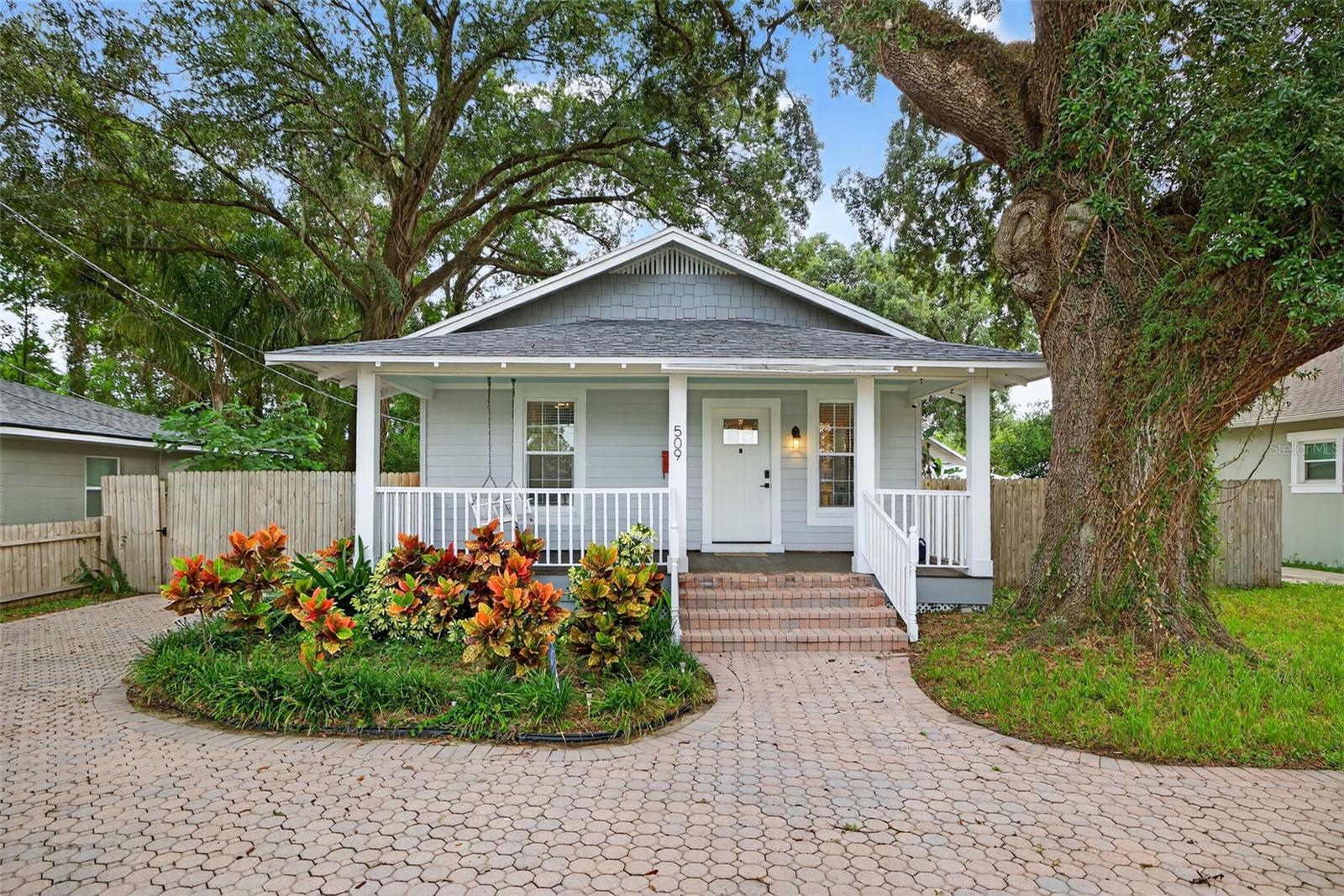 Well-maintained 3-bedroom, 2-bath home in the heart of Seminole Heights. This property offers an open layout with tall ceilings, plenty of natural light, and thoughtful updates throughout. The kitchen is equipped with shaker cabinets, granite countertops, stainless steel appliances, and a modern range hood, along with a small dining nook and a convenient bar top for casual meals. The primary suite is impressively spacious for a bungalow, offering a large walk-in closet and enough room to create an office space or sitting area, which is a rare find in a home like this. Out back, enjoy a generous yard with a wood deck and storage shed, while the wide paver driveway provides ample parking and a welcoming first impression. Major updates include roof (2019), HVAC (2018), electric panel (2018), and newer windows. A previous 4-point report is available upon request. The home is conveniently located near DI Coffee Bar, Jug & Bottle, Trip’s Diner, Xtreme Tacos, and just minutes from Publix and I-275.