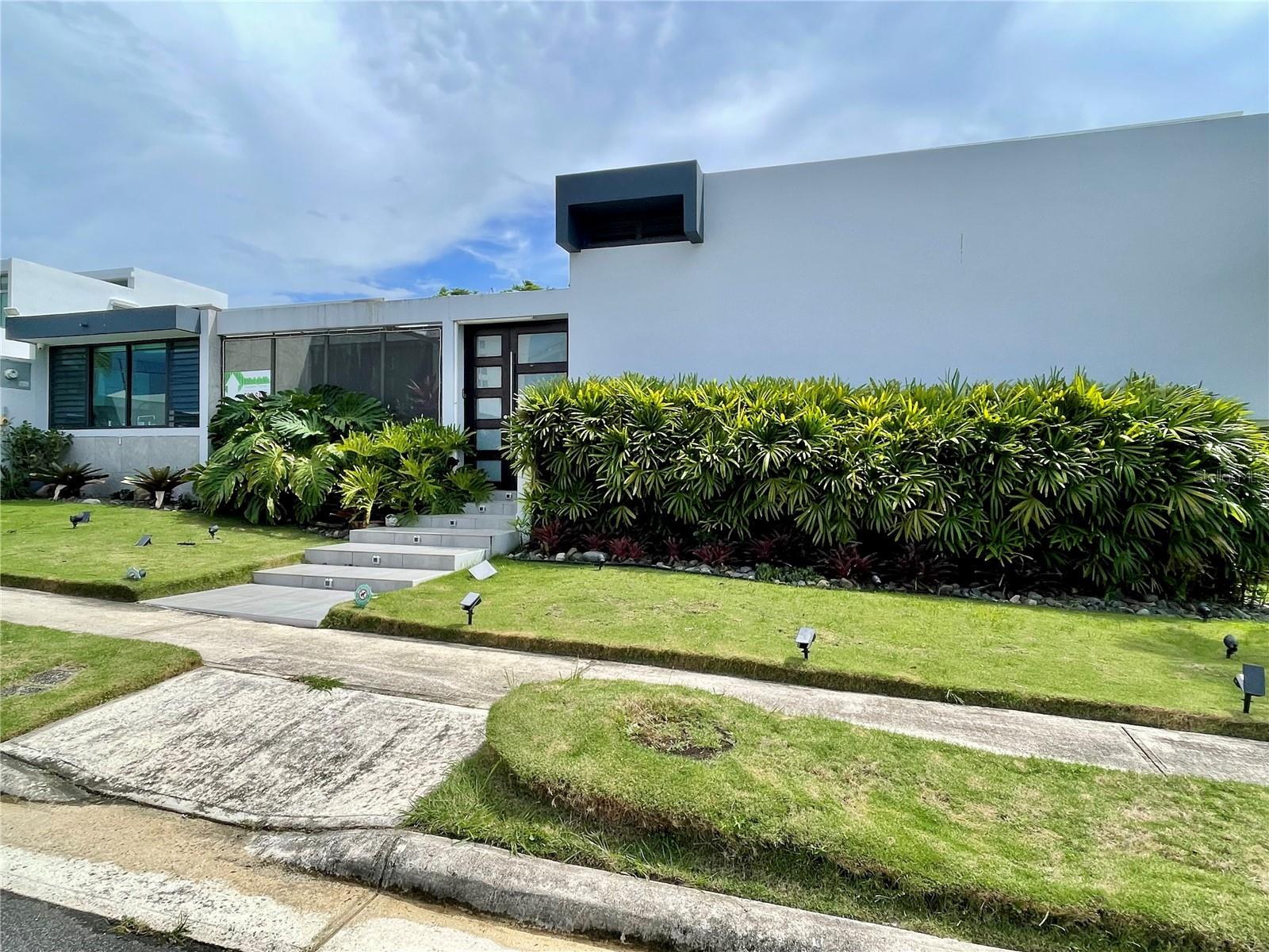 Luxurious Home in the exclusive Guaynabo Gated Community of Caparra Hills.
Discover this stunning property located steps away from San Patricio Plaza in Guaynabo's most sought after gated community. Designed for elegance and comfort, this home features 3 bedrooms and 3.5 bathrooms, a Saltwater Pool, Expansive terrace perfect for entertaining. It is sustainability provides convenience, as it is equipped with solar panels (it's not leased), a full power generator and a 600 water cistern. Double to three car garage, for secure parking.
Only a 15 min drive to the airport, seconds to shopping malls, 25 minute drive to Old San Juan, close to top private schools, and access to immediate highway and main roads.
This home combines luxury living with modern amenities, all in a prime location.