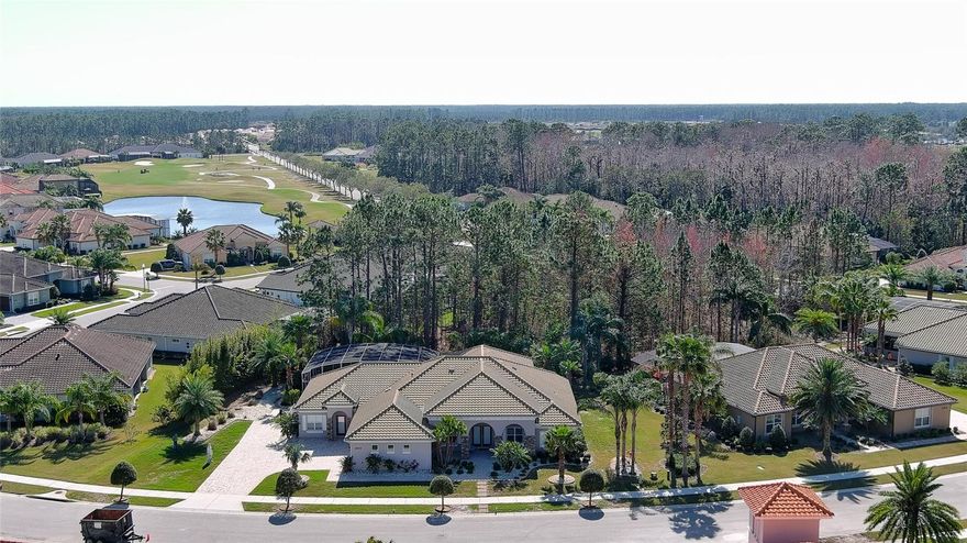 Welcome to Exclusive Portofino Estates, a gated enclave within the Venetian Bay Golf Community. Residents enjoy access to a vibrant Town Center featuring boutique shops, restaurants, a fitness center, and more, all just minutes from the sparkling shores of the Atlantic Ocean in Central Florida. This expansive 5-bedroom, 4-bath estate home sits on a premier lot and includes a private-entry in-law suite, ideal for multi-generational living or guest accommodations. Built by The Johnson Group in timeless Mediterranean style, this residence features a hip roof with concrete clay tile, paved walkways, and an oversized 3-car garage. A charming brick-and-stone front entry with covered deck welcomes you through double doors into a light-filled foyer. To one side is a private home office complete with custom desk and built-in cabinetry. On the other side , a formal dining room connects seamlessly to the chef’s kitchen, which boasts stainless steel appliances, granite countertops, upgraded wood-and-glass cabinetry, a breakfast bar, and an informal dining area -perfect for casual mornings or entertaining guests.
The spacious interior living room features a custom floor-to-ceiling entertainment center and flows effortlessly into the outdoor living area. This inviting space includes a fireplace, summer kitchen, and a fully equipped entertainment area your very own man cave for year-round enjoyment. Electric hurricane shutters provide peace of mind and added privacy during inclement weather. Step outside to the stunning 1,591 sq ft screened lanai with tiled deck, pool and spa, and a waterfall with fire pit feature a true backyard oasis. A naturally landscaped palm-lined pathway wraps around the rear of the property, enhancing the tranquil setting. This thoughtfully designed home offers multiple sliding glass doors and decks with direct pool access, as well as a full bath off the outdoor living room for added convenience.
A split floor plan ensures privacy, with the primary suite featuring dual walk-in closets, a block-enclosed safe room with steel door, garden tub, glass-enclosed shower, and dual vanities.
On the opposite side of the home, three guest bedrooms, with comfort and flexibility. One features an ensuite bath, while the remaining two share a Jack-and-Jill bathroom with hallway access.
Additional features include plantation shutters throughout, a home security system, and a private-entry in-law suite with its own kitchenette, full bath with shower, ideal for guests, caregivers, or extended family.
All information is intended to be accurate but not guaranteed.