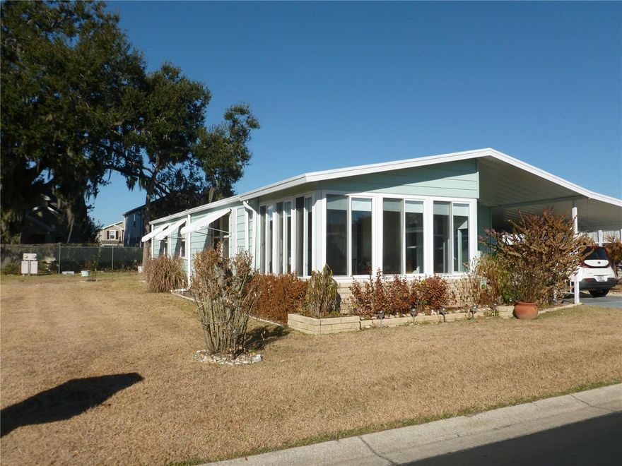 Welcome to Timber Lake Estates, an all aged community! This wonderful 2 bedroom 2 Bath home is waiting for you. This home features two storage sheds, Updated windows, Kitchen was remodeled with soft close drawers. Rear lanai and outside patio, Front Florida room with open and close windows, The Master suite has an updated Bathroom. The guest bath has a large built in linen closet. This home is in a great location with easy access to Wesley Chapel and Zephyrhills. All this and located in a very desirable all aged well kept family oriented community with tons of activities and great amenities some of which include 2 pools, 2 clubhouses, Shuffleboard and Basketball courts, fishing lake with dock and YOU OWN THE LAND.