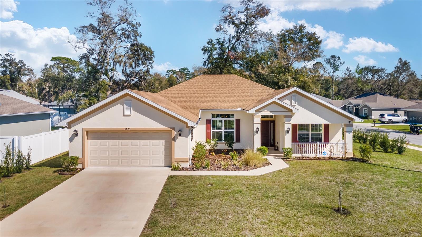 BUYER'S HOME SALE CONTINGENCY FELL THROUGH! Magnificent 4/3/2 PLUS OFFICE in the gated community of Silver Run Forest! Great curb appeal with front porch! ALMOST NEW 2023 home with $46k in UPGRADES ~ high end finishes! Oversized corner lot facing green space. This home is IMMACULATE and move-in ready! Spacious home with 2292 ft living space. NO CARPET. Semi-open floor plan with high ceilings, crown molding, plank tile flooring, dimmer switches, and Quartzite countertops throughout. Office/den/flex room has double doors with transom. Kitchen has breakfast nook with bay window, breakfast bar, SS appliances, pantry, full wall backsplash, and plenty of counters/cabinets. Split bedroom plan. Primary suite has lanai access, tray ceiling, TWO WALK IN CLOSETS, dual sinks, walk in tile shower, garden tub, and water closet. One of the four bedrooms makes a great IN-LAW suite with a private bathroom. Inside laundry has matching cabinets for extra storage. Screened lanai overlooks paver patio and private backyard with vinyl fence on 2 sides. Home includes gutters, Aquasure water softener, and additional landscaping. Peaceful gated neighborhood is convenient to shopping, dining, Silver Springs State Park, Ocala Civic Theatre, Appleton Museum, and minutes to downtown Ocala!