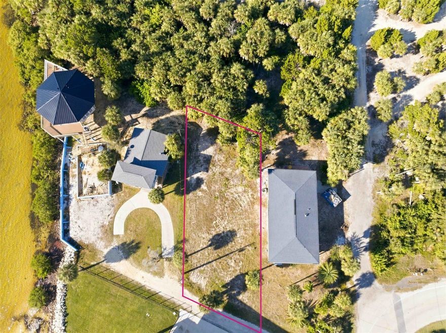 This is a rare chance to own a true piece of Old Florida paradise. One of the very few remaining buildable lots on Pine Island, this property already has over 500 yards of clean fill dirt brought in and professionally graded, making it completely ready for your dream home. Included in the sale are fully county-approved architectural plans for a stunning 2,048 sq ft, three-story coastal residence thoughtfully designed to capture breathtaking, unobstructed Gulf of America views from virtually every major room. Daily sunsets here are nothing short of spectacular—exactly what you moved to the coast for.
Whether you build the approved modern design or bring your own vision, construction can begin almost immediately. Living on Pine Island puts white-sand beaches and the newly renovated Pine Island Park just a short walk away, with Bayport Pier and public boat ramps minutes from your door. You’ll also enjoy the world-famous crystal-clear Weeki Wachee River (home to manatees), the iconic mermaid show, and Buccaneer Bay Water Park. Best of all, residents have the option of a private community boat ramp right on the island for just $40 per year.  What more could you ask for?