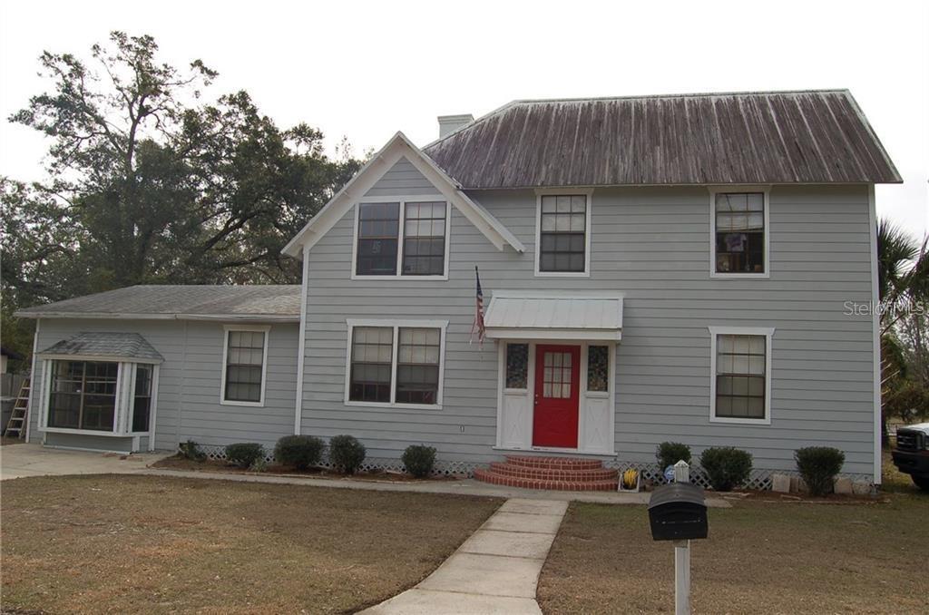 Come claim your piece of history! This beautiful historic home features 3 bedrooms and 2 bathrooms with 2,700 sq ft of character and individuality. Upon entry, you're greeted by a spacious foyer—perfect for shoe racks, coat hangers, or personal touches—which currently houses a 1903 pump organ, a wall of shoe shelving, and two chairs. Straight ahead, French doors open to a cozy sunroom. To the right is the primary bedroom, offering generous space for your decorative ideas, while to the left is the living room, showcasing high beams and a charming fireplace. A flexible space currently used as a formal dining room flows into the kitchen, which comes fully equipped with a range hood, glass-top electric stove, dishwasher, refrigerator, and disposal. A breakfast bar separates the kitchen from an additional dining area featuring a second fireplace. The downstairs bathroom includes a new bath and shower combo, granite vanity, and ample storage. At the rear of the home is a studio/mancave with a private entrance, wood-burning fireplace, and dedicated A/C unit, along with a laundry room that also serves as storage. Upstairs, you'll find 2 additional bedrooms, a full bathroom, and a flex space ideal for an office, den, or playroom. The home features wood laminate flooring throughout, real wood floors in the kitchen, and ceramic tile in the bathrooms. Major updates include an upgraded electrical panel (08/2018), a solar panel system (01/2021), attic insulation with compression/expansion foam (08/2020), new toilets (08/2021), chair rail moldings (08/2018), and second-floor flooring (08/2018). Zoned for multiple dwellings, this home offers incredible investment potential—easily convertible into 3 separate units: the original 3 bed / 2 bath, a 1 bed / 1 bath, and a full studio / 1 bath—allowing you to potentially triple your rental income and maximize ROI. This is more than a home—it's a rare opportunity to own a valuable piece of history!
