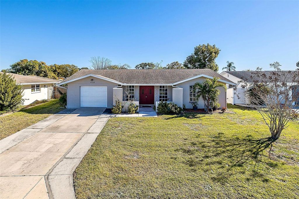 Photo of 10328 Holly Drive, Port Richey, FL 34668 (MLS # TB8465297)