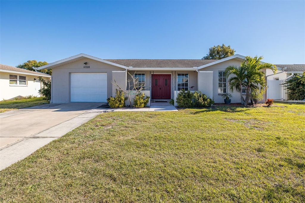Photo of 10328 Holly Drive, Port Richey, FL 34668 (MLS # TB8465297)