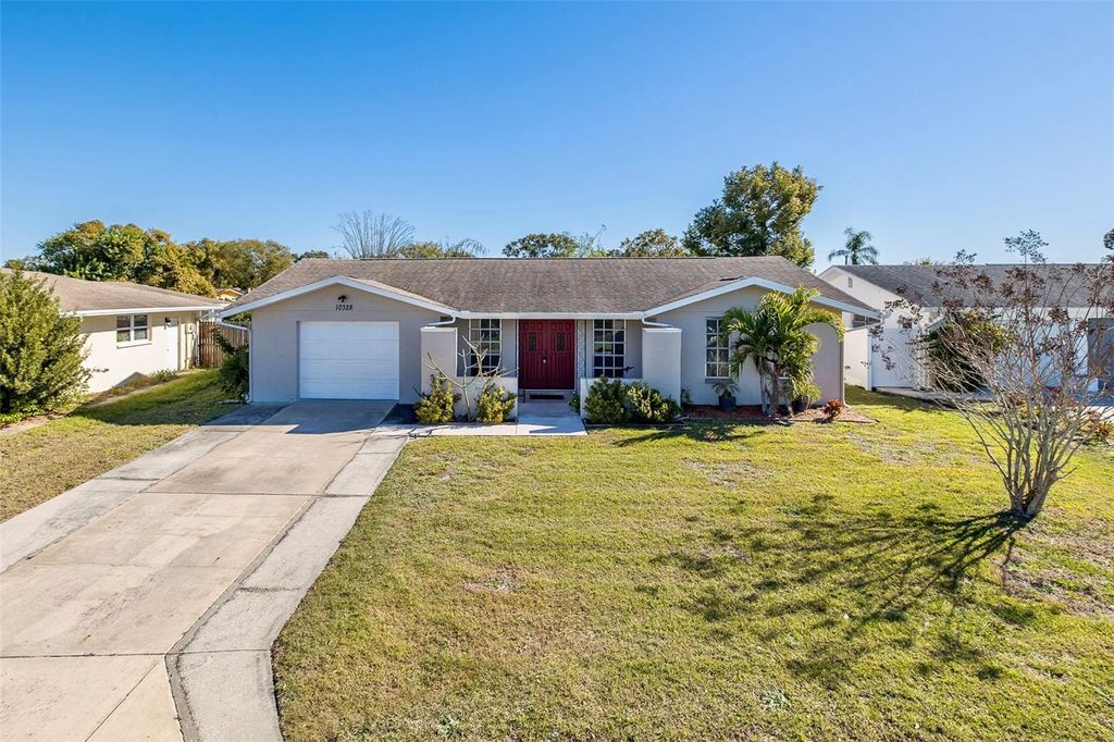 Photo of 10328 Holly Drive, Port Richey, FL 34668 (MLS # TB8465297)