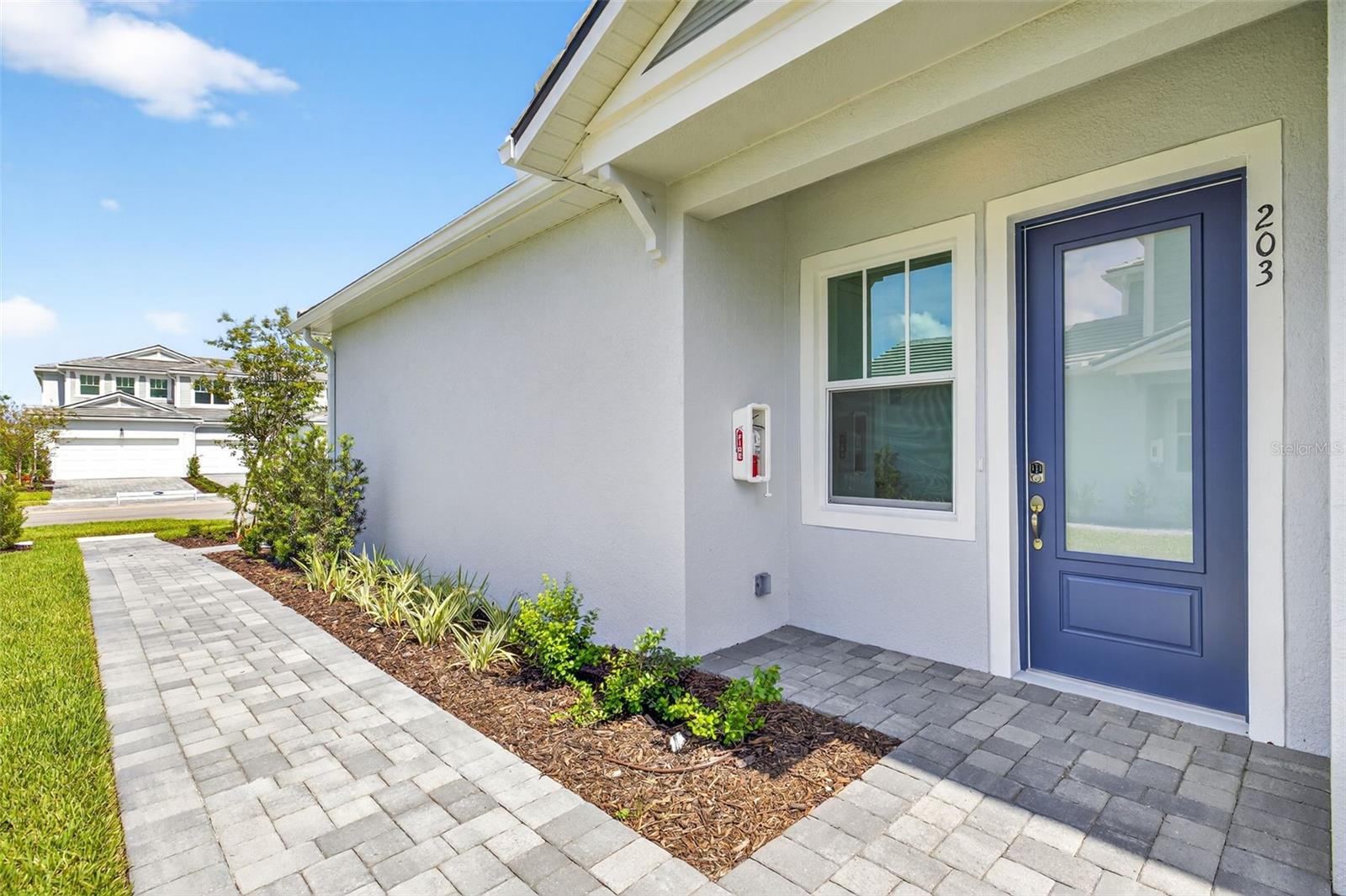 Under Construction. The Oceangrove II plan is the largest coach home available in the community with 2 bedrooms, 2 baths, a study, a 2-car garage, and condominium ownership. This open floorplan offers optimized living spaces and is perfect for entertaining guests for a few hours or days. The entrance of this home features a welcoming covered entry or convenient owner's garage access. The main living area is just up the stairs. The designer kitchen is adjacent to the dining area and Great Room. It features an island with a breakfast bar that will seat up to 5, cooktop with stainless vent hood and wall oven/micro combo. There is a full set of 42" upper shaker style cabinets on each side of the vent hood, which also provides an abundance of counter space. The extended island also provides more prep space. There is also a walk-in pantry that lends itself to plenty of space for food and accessories. The dining room is adjacent to the kitchen in its own space and the Great Room is completely open to both areas, making it easy for conversation and enjoyment to flow freely throughout the spaces. A covered balcony is located just outside the Great Room and provides the opportunity to enjoy the beautiful Florida weather and air. The primary suite is a quiet retreat with a well-appointed primary bath with glass enclosed shower with built in ledge and extensive walk-in closet. The secondary bedroom is located on the front of the home, just across from the second full bath that features a convenient tub and shower combo. The study includes a closet and provides a versatile space for a home office, den or 3rd bedroom. Stylish shaker style cabinets in pure white and contrasting countertops in Soapstone quartz throughout. Luxury vinyl plank flooring covers the main living area and study, while the bedrooms have plush carpeting. The home also uses impact windows for safety. Featuring ClareOne Smart Home Technology package that connects to video doorbell, garage door and front door lock. Photos, renderings and plans are for illustrative purposes only and should never be relied upon and may vary from the actual home. Pricing, dimensions and features can change at any time without notice or obligation.