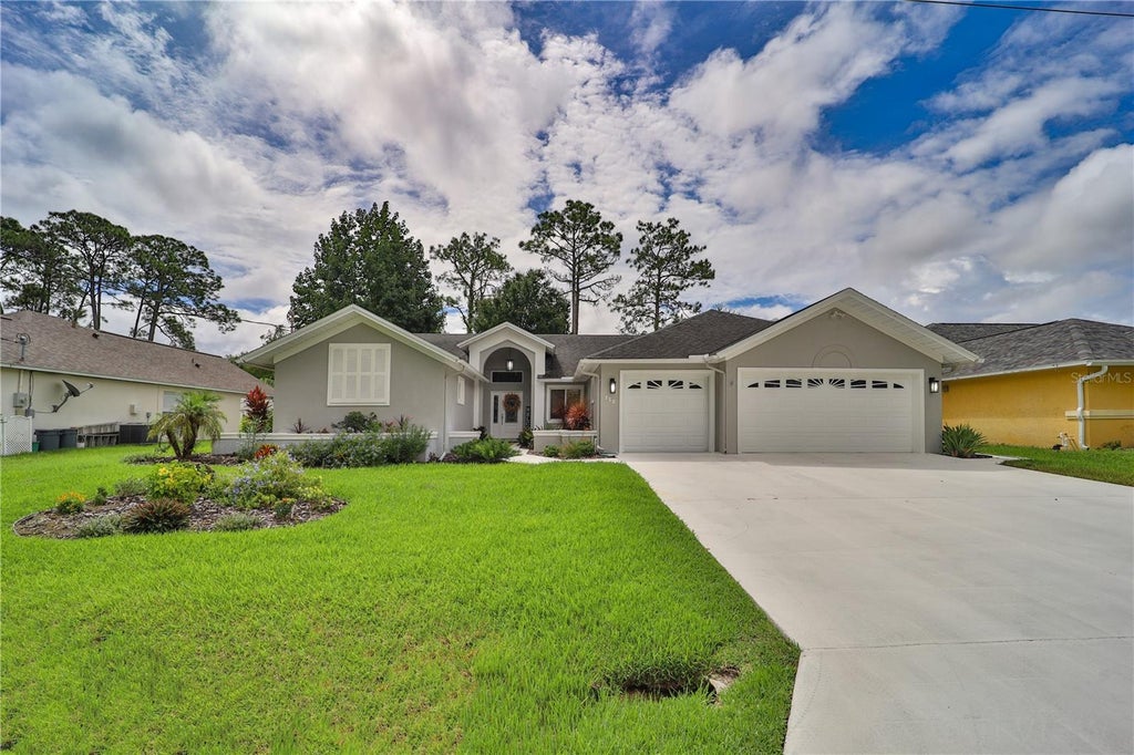 Photo of 112 NE Wellstone Drive, Palm Coast, FL 32164 (MLS # FC321257)