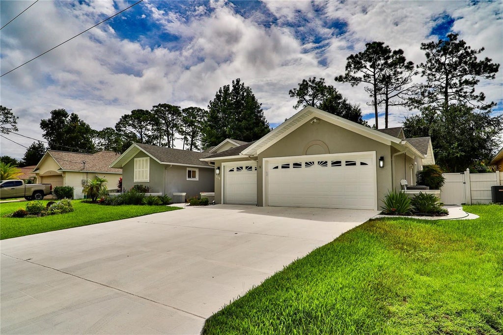Photo of 112 NE Wellstone Drive, Palm Coast, FL 32164 (MLS # FC321257)