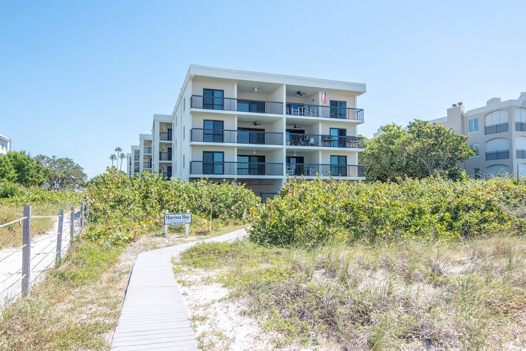 This fantastic beach front condo is located in highly sought after Pass-a-Grille only 1 block from the iconic Don Cesar Hotel! The views of the turquoise waters of the Gulf from the huge wrap around balcony are magnificent. This fully furnished condo has been completely remodeled from top to bottom: brand new kitchen cabinetry, new quartz countertops, all new appliances, both bathrooms have been totally redone and all new wood flooring throughout the entire unit. Featuring 3 spacious bedrooms, 2 full bathrooms and tons of closet space, all that is missing is you! Enjoy a vacation lifestyle as a private beach path, community pool, bike storage, water, sewer, trash, internet and reserved parking for 2 cars are all included. This is beach life at its finest!