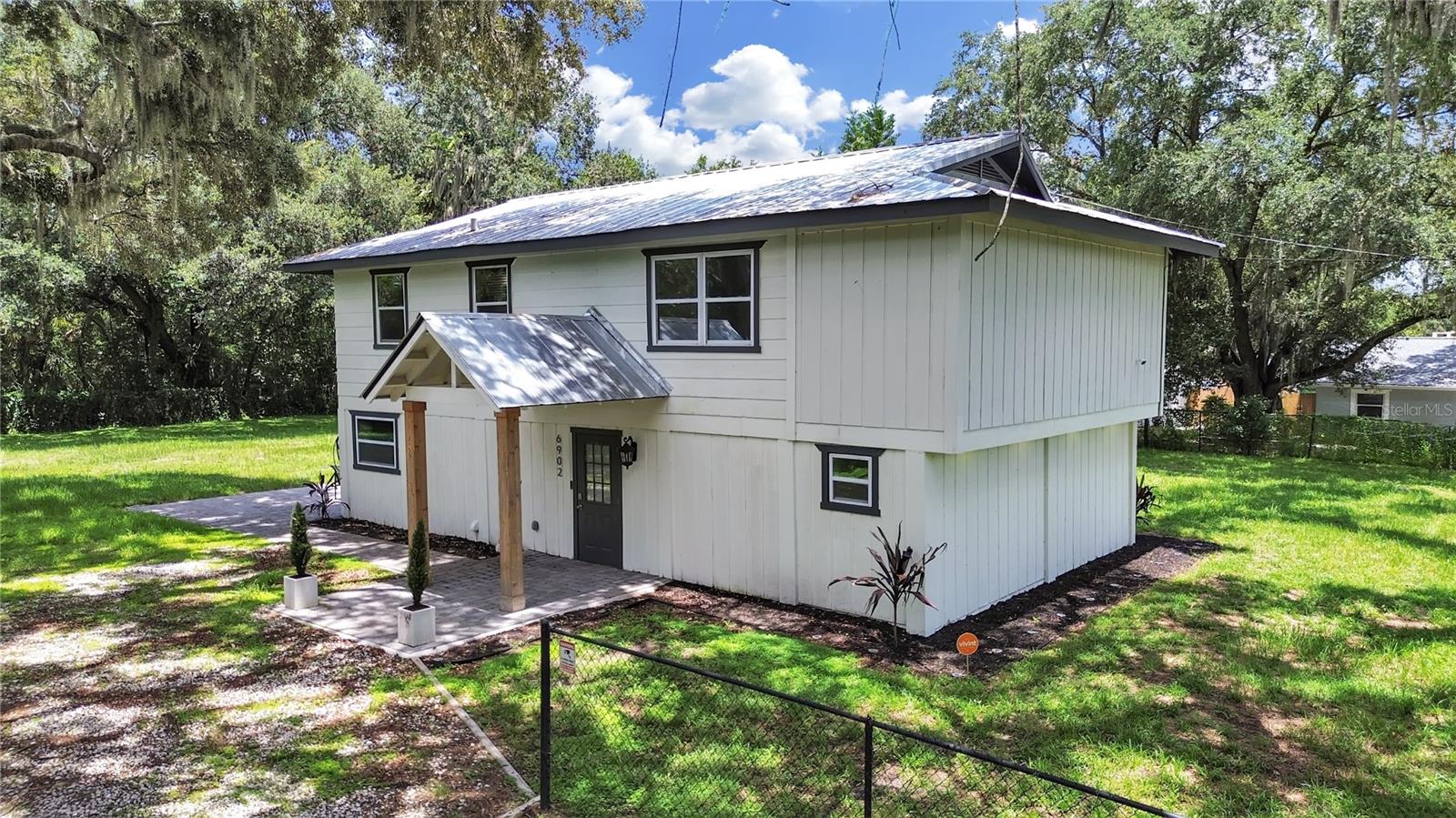 Welcome to your new oasis in the heart of Tampa! This beautifully updated 4-bedroom, 3-bathroom home offers a perfect blend of modern comfort and convenient access to the city’s best attractions. Located just minutes from the Selmon Crosstown, downtown Tampa, Ybor City, and the Hard Rock Casino. This residence provides both luxury and an unbeatable location. The open-concept floor plan features spacious living areas with an abundance of natural light, creating a warm and inviting atmosphere. The heart of the home is a gourmet kitchen, equipped with stainless steel appliances, granite countertops, a large island with seating, and ample cabinetry—ideal for both casual dining and entertaining. The primary bedroom is a true retreat, complete with a walk-in closet and an elegant en-suite bathroom that boasts dual vanities, and a separate walk in shower. Each additional bedroom is generously sized and well-appointed, offering comfort and flexibility. Modern bathrooms throughout the home feature stylish fixtures and finishes, providing both convenience and sophistication. Step outside to the almost half acre grand backyard, a serene space perfect for outdoor dining, gardening, or simply relaxing. Enjoy the best of Tampa’s vibrant lifestyle with easy access to downtown’s cultural and dining hotspots, the historic charm of Ybor City, and the thrilling entertainment options at the Hard Rock Casino. This home combines modern amenities with a prime location, offering an exceptional living experience. Don’t miss out on the chance to make this your new home—schedule a showing today and see what makes this property truly special!