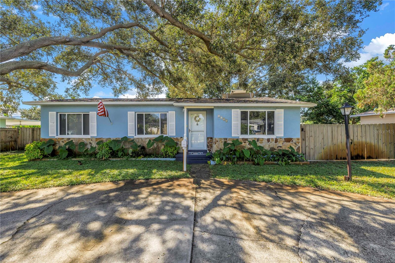 Beautiful and updated home in highly desirable Lake Pasadena neighborhood. This home has three bedrooms, two full bathrooms, and original hardwood floors. This home has a newer kitchen and has been well maintained. The home has a large fenced in back yard, which has a parking pad for a boat or RV. The roof was replaced in 2020, the air conditioner in 2023, the hot water heater in 2023, and the fence in 2020. It also has a circular driveway, and well pump irrigation. This property is high and dry, and in flood zone X. This home is located in a prime location and is close to the beaches, the Tyrone Mall, is an easy commute to downtown St. Petersburg, shopping, dining, and entertainment.