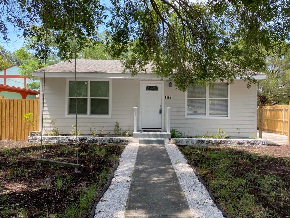 Move-in ready, recently updated, 4 bedroom, 3.5 bath home on corner lot in Pasadena Bear Creek neighborhood with no HOA or flood insurance required. Large shade trees, an old-fashioned wooden swing, and new wood fencing frame this charming home; but don't let the outside fool you...it's bigger than it looks! This spacious home with 1960 sq/ft of heated living space has been updated with light neutral tones throughout. Great home for entertaining with living room, two bedrooms and full bath in front half of home and wide hallway with half bath leading to rear half of home with large, open kitchen/family room and two more bedrooms, each with en suite bath. Indoor laundry room with full size washer/dryer make doing laundry less of a chore. Sliding glass doors lead from family room to new large covered deck overlooking fenced in yard - a great place to gather with friends or family, rain or shine. Side door between kitchen/family room takes you to the fenced in side patio area where you can grill, sun, or dine in privacy. Conveniently located near shopping, dining, banking, entertainment and recreation and just a short drive to golfing, downtown Gulfport or St Petersburg, Treasure Island, and beautiful gulf beaches. Schedule your showing today...
