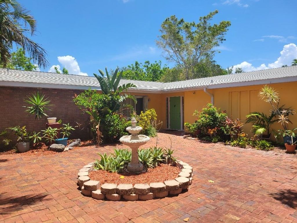 Photo of 315 S Tessier Drive, St Pete Beach, FL 33706 (MLS # TB8410465)