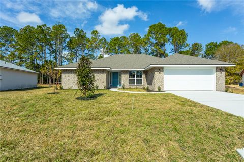 Photo of 14 Sea Breeze Trl, Palm Coast, FL 32164 (MLS # FC314703)