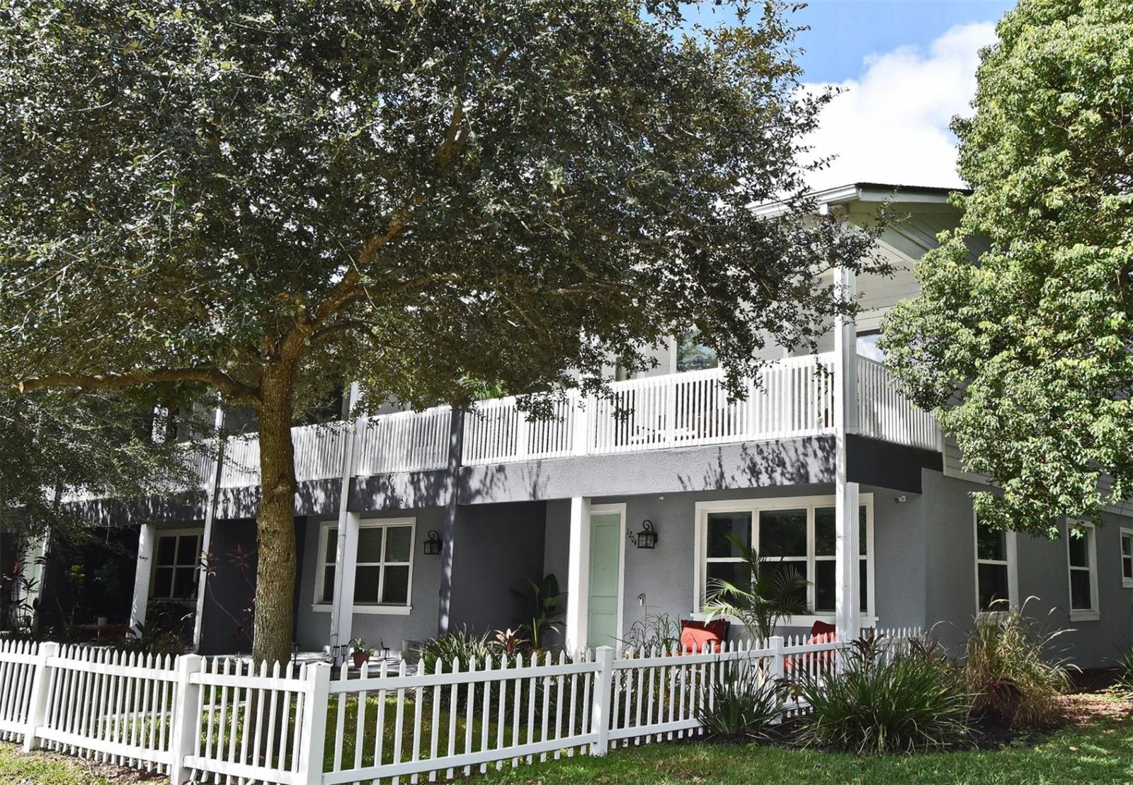 Low maintenance living with a downtown vibe! Come take a look at this well maintained, end-unit townhome in the highly sought after Lake Como area. Conveniently located minutes from Downtown Orlando, the Milk District and literal steps to the Hourglass District restaurants/breweries & beautiful Lake Como Park. At just under 2000 sqft this spacious townhome boasts high ceilings and an open floorplan with stainless steel appliances, hardwood cabinets, granite, tile flooring and high end finishes. Enjoy beautiful Florida living as all three bedrooms have access to large balconies with the Primary Suite opening onto a 20 x 10 ft private balcony! This unit also features an oversized 2-car garage as well as a fenced-in front yard. Low HOA fee covers grounds upkeep, termite treatment and monitoring plan with Orkin, outside building maintenance (paint, pressure washing, etc), roof replacement fund, and insurance for common areas and building shell.