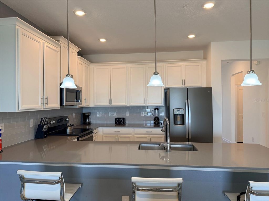 Photo of 1115 Challenge Drive, Davenport, FL 33896 (MLS # O6398678)