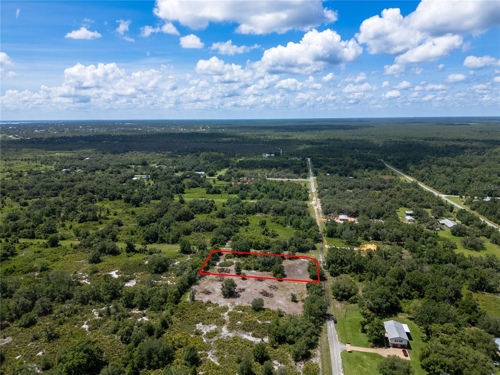 This lot is prepped for building. The homesite has been cleared while preserving privacy trees and a peaceful nature trail — a $7,500 value already done. A perc test was done for up to 4 bedrooms, so you can install a septic system — a $550 value with testing completed. A brand new private well was installed on June 20, 2025 (75 ft deep, capped and ready to connect) — a $5,500+ value included. An environmental report was done and cleared / county-approved with no cutthroat grass — a $1,500 value already handled.
Electric service available through Duke Energy.
This property is high and dry in an X flood zone — no flood insurance required. It’s located on a quiet, partially paved road in a peaceful, well-kept neighborhood.
The heavy lifting is done. Just bring your vision.
Lot lines are approximate.