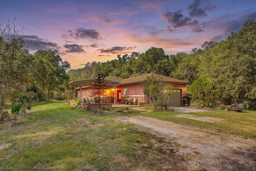 Situated on a beautiful 2.59-acre high-and-dry lot, this property offers the perfect blend of privacy, space, and convenience in desirable southwest Lakeland. The home features a versatile bonus room in the back that can easily be used as a 3rd bedroom, home office, gym, or flex space to fit your needs. Even better, this home is USDA eligible, meaning qualified buyers may be able to purchase with no down payment required. Inside, you’ll find tile flooring throughout the entire home for easy maintenance and a clean, modern feel. The spacious kitchen offers an abundance of cabinet storage, granite countertops, and stainless steel appliances. The primary bathroom features granite countertops, a walk-in shower, and a walk-in closet, while the guest bathroom is conveniently located next to the guest bedroom and also includes granite countertops. Step outside and enjoy the screened-in lanai overlooking the expansive property, along with a huge outdoor pavilion that’s perfect for entertaining, gatherings, hobbies, or additional covered outdoor space. Additional updates include the HVAC condenser which was replaced in 2025. Conveniently located near Interstate 4, Polk Parkway, and State Road 60, providing easy access to Tampa and Orlando. The property is also close to Lakeland Linder International Airport and SUN ’n FUN Expo. Enjoy being just a short drive from Lakeside Village, featuring shopping, restaurants, coffee shops, and a movie theater, along with nearby Publix, Walmart, and Target for everyday convenience. You'll also love being close to vibrant Lakeland downtown dining and entertainment. Outdoor enthusiasts will appreciate nearby Bonnet Springs Park with its walking trails, playgrounds, gardens, and community events, along with Peterson Park for additional recreation opportunities—all while still enjoying the peaceful feel of country living.