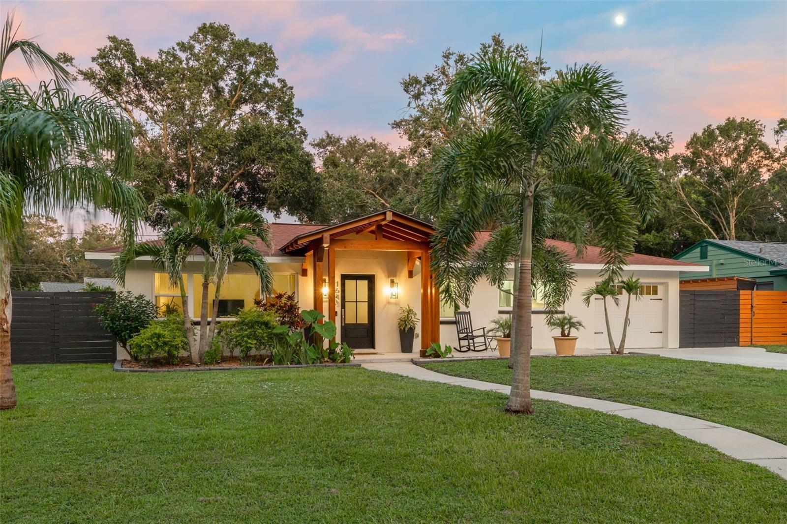 Under contract-accepting backup offers. The seller states that this stunning 2-bedroom, 1-bathroom home with a detached in-law studio offers the perfect blend of luxury, comfort, and modern upgrades—just minutes from Downtown Dunedin, top-rated beaches, and serene parks. The exterior has been tastefully updated with lush landscaping and a stunning portico that beckons you inside. Upon entering the home, you will be dazzled by the architectural design, clean lines, open layout, and tranquil ambiance. The sellers spared no expense breathing new life into this home. They replaced the plumbing and sewer lines, updated the electrical wiring, replaced the AC unit and ductwork, and upgraded to impact windows and exterior doors, including the garage. The renovated kitchen features sleek quartz countertops, modern cabinetry, and stainless steel appliances. The home boasts elegant French oak hardwood flooring, solid wood interior doors, and refinished walls and ceilings throughout. The spacious primary bedroom provides a peaceful retreat, featuring French doors that open directly onto the backyard oasis. The second bedroom was extended and includes ample storage with a built-in closet system. The updated bathroom showcases elegant floor-to-ceiling tile and a modern walk-in shower. In the backyard, you’ll find a detached 10’x12’ studio—complete with its own A/C and electrical—offering a flexible space for guests, a home office, or an art studio, all built to current hurricane code. The private backyard sanctuary is thoughtfully designed for both relaxation and entertaining. Unwind by the cozy fire pit, sip your morning coffee or evening drink on the patio deck nestled within a zen garden, or rinse off in the outdoor shower after a day at the beach. The screened-in lanai provides a comfortable, pest-free space to enjoy the Florida lifestyle year-round—perfect for dining al fresco or simply unwinding with a good book. No detail was overlooked; this home is move-in ready and one-of-a-kind in the heart of Dunedin. Review the feature sheet in the attachments for a detailed list of all the upgrades and renovations the sellers have made. Schedule your showing today!