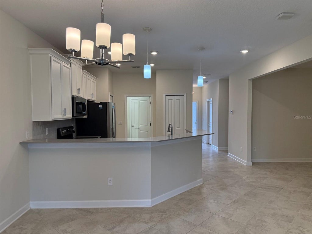 Photo of 3537 Belland Circle #E, Clermont, FL 34711 (MLS # R4911937)