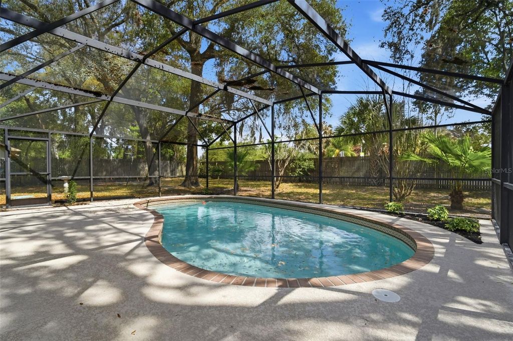 Photo of 8315 Camphor Tree Drive, Orlando, FL 32810 (MLS # O6388418)