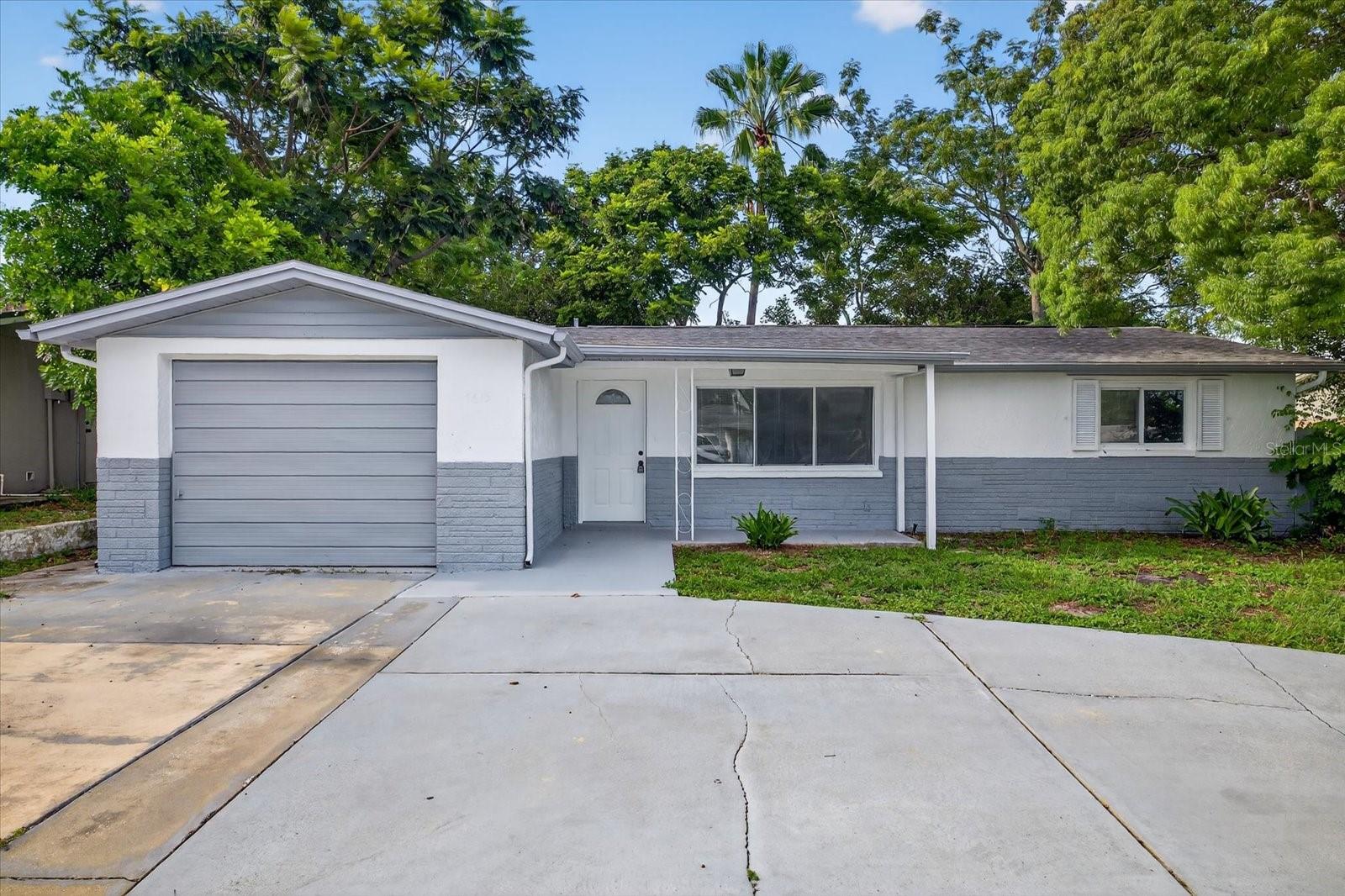 Charming, updated ranch-style home in Port Richey’s Palm Terrace Gardens. With 3 bedrooms and 2 full baths in approximately 1,261sqft of living space. The bright, open living and dining area transitions to a well-equipped kitchen with updated cabinetry and countertops. The primary suite includes a walk-in closet and private bath. Two additional bedrooms share a full hallway bath. Outside, enjoy a fenced backyard and semicircular driveway plus attached one-car garage. Sought-after location with no HOA or CDD fees, moments from US-19, SR-52, shopping, dining, and beaches—ideal first home or investment property.