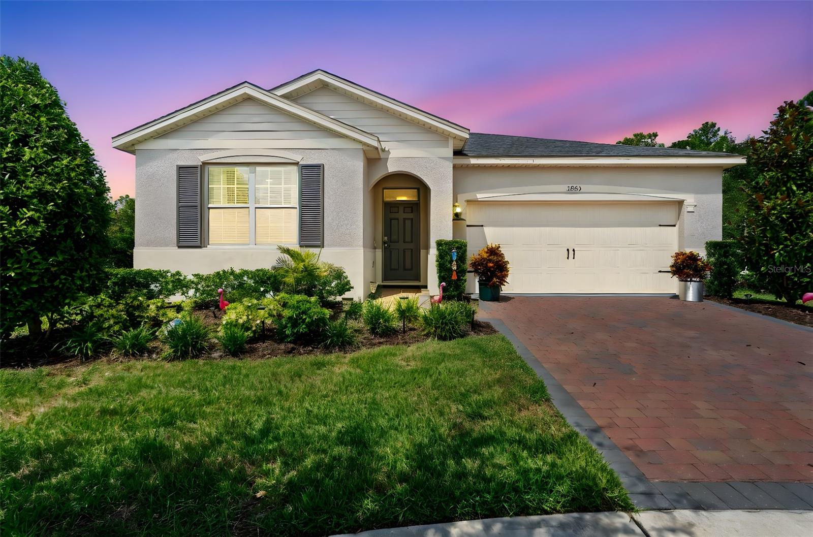 Welcome to this beautifully maintained CLIFTON MODEL home located in the highly desirable PALMS AT SERENOA, a vibrant 55+ gated community in Clermont, Florida. Built in 2021, this 2-BEDROOM, 2-BATH HOME with a FLEX ROOM/OFFICE offers 1,822 SQUARE FEET of thoughtfully designed living space on an EXTRA-WIDE, PIE-SHAPED LOT at the end of a CUL-DE-SAC, bordered by CONSERVATION ON TWO SIDES for the ultimate in privacy and tranquility.
This property is also a SMART HOME, offering modern convenience with integrated technology for added comfort and peace of mind.
The heart of the home is the open-concept kitchen featuring QUARTZ COUNTERTOPS, DOVETAIL CONSTRUCTION CABINETS, and a LARGE CORNER PANTRY—perfect for both everyday cooking and entertaining. The spacious living and dining areas are filled with natural light and lead to the EXTENDED, SCREENED-IN COVERED LANAI, offering a peaceful spot to unwind or enjoy a morning coffee surrounded by nature.
The PRIMARY SUITE is oversized and includes DUAL WALK-IN CLOSETS along with a STEP-IN SHOWER, while the second full bath features a TUB, ideal for guests. This home has absolutely NO CARPET—TILE FLOORING IN MAIN AREAS and LAMINATE FLOORING IN THE BEDROOMS create a stylish, low-maintenance finish throughout.
A 2-CAR GARAGE provides ample storage and convenience, and the ROOF WAS REPLACED IN 2024, giving added peace of mind. The split-bedroom layout allows for privacy and functionality, making this home perfect for full-time residents or snowbirds looking for a seasonal retreat.
Living in Palms at Serenoa means enjoying RESORT-STYLE AMENITIES including a gated entrance, a CLUBHOUSE WITH ZERO-ENTRY POOL, a STATE-OF-THE-ART FITNESS CENTER, PICKLEBALL AND BOCCE BALL COURTS, a FIRE PIT AREA, and TWO DOG PARKS. It’s a friendly, active community that makes it easy to stay social and enjoy the Florida lifestyle to the fullest.
This move-in ready SMART HOME offers comfort, style, and unmatched privacy—all in a prime location close to shopping, dining, and just a short drive from Disney World and major highways.
SCHEDULE YOUR PRIVATE TOUR TODAY and come see why this beautifully upgraded home in Palms at Serenoa is the perfect place to call your own.