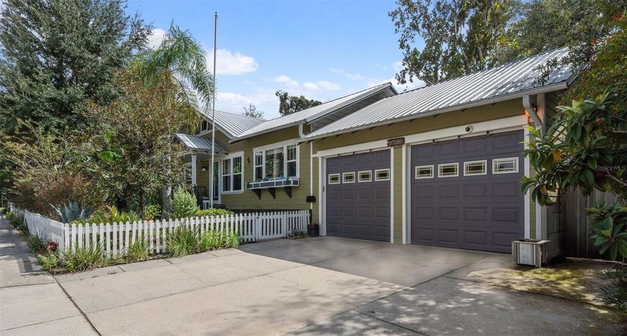 Talk about the WOW factor!!! This STUNNING 1930s FULLY MOVE-IN READY VINTAGE  3BR/2BA SFH that is a timeless beauty blending vintage character, modern luxury, and peaceful outdoor living all together on a .33-acre parcel.  Located in the heart of Dade City,  this home boasts of strength and craftsmanship that reminds us of the way they built homes long ago. Homes exterior is constructed of Dade City Pine and Hardie board and offers a METAL ROOF (2019), HIGH CEILINGS throughout, and is FULLY REMODELED.  ELEGANCE and comfort around every corner with spa-inspired bathrooms and a freshly painted spacious kitchen completely updated with new ceilings, pocket lighting,  gorgeous new Quartz countertops, a fabulous vintage sink, and solid wood cabinetry stripped and repainted,  plus brand new tile flooring installed that combines vintage allure with modern convenience.  There are HICKORY WOOD FLOORS and abundance of recessed lighting that enhances the bright, open living spaces.  A tray ceiling in the family room with  CUSTOM BUILT-INS. The FORMAL DINING ROOM offers built-in bench seatings and underneath storage.  The large dining room windows offer a dual benefit by bringing in natural light while providing a PICTURESQUE view of the OUTDOOR GARDENS that makes eating in pleasurable while soaking in the beauty of your surroundings. Enjoy illuminated lighting within your lush backyard garden TROPICAL OASIS, complete with fruit trees plus orange trees & 4 kumquat trees,  raised garden beds, seasonal flowers and winding paths through vibrant greenery. MULTIPLE DECKS off the family room, kitchen, and third bedroom, you’ll have plenty of outdoor spaces to enjoy nature. Plus, a decorative, & fully functioning OUTDOOR SHOWER,  UPDATED HARDY BOARD SIDING, PLUMBING, NEWER DOUBLE-PANE WINDOWS, and 2022 mini-split systems for top-tier ENERGY EFFICIENCY,  NEWER TANKLESS WATER HEATER and BRAND-NEW STACKABLE WASHER AND DRYER for added ease. The primary bedroom floors have been stripped to their ORIGINAL WOOD, offering a blank slate for your personal touch. Also featuring two French doors opening onto a SLATE PATIO that provides the perfect place to unwind and enjoy your unique BACKYARD Oasis. The 2-CAR ATTACHED GARAGE includes a separate storage space, PLUS A ONE-CAR WORKSHOP with its own water supply and electrical panel can be easily converted into a stand alone studio if desired. Two decorative non-working fireplaces between family and living rooms add CHARACTER AND CHARM. PRIVACY FENCING surrounds the LUSH BACKYARD, while the front yard is framed by a classic white picket fence.  You are going to love this property.... Truly a must see!!!
**All information deemed reliable but not guaranteed*