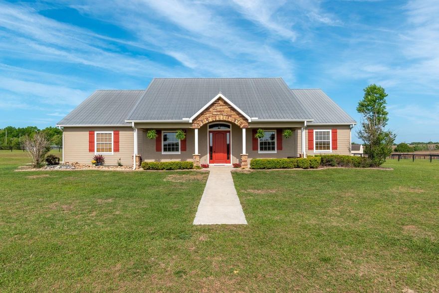 YELLOWSTONE in Florida ...Located in a quiet Agricultural Farm area in Marion County. you will think you just walked into Duttons place.  Just 18 miles from the World Equestrian Center and 5 miles to the Rainbow River for kayaking & tubing. This Custom 4/3/1 (2602 sf under air) Pool Home sits on 17.38 Acres overlooking the Gorgeous Countryside from a gentle sloping hill . Additional acreage (up to another 66+- acres) is available. You will love the Charm of the Stone Accents and Metal Roof on the outside and once inside appreciate the 18' Ceilings, Massive Stone Fireplace, Wood beams and Custom wood inlays . The Spacious Kitchen is will accomodate any chef with a center island, Breakfast Bar, Cherry Cabinets, Granite Counters, SS appliances and a 4 burner Gas Stove (250 gal. tank is owned and buried). There is a nice sized Formal dining room as well. The Primary Bedroom ensuite is generous in size, has 2 walk in Closets and private access to the Pool area. The guest rooms all have walk in closets and one has it own ensuite. The laundry room is sure to impress with plenty of room and a walk in closet for storage. The Pool ( salt / heated) and added living area is the perfect place to unwind after a long day . The covered Lanai is huge with a BBQ / Kitchen Prep area and multiple seatings that invite entertaining...Cornhole anyone? Add to this an adorable 6 stall center aisle Barn with covered storage and a lean to on the side for horses to get out of the weather. There are Several Paddocks fenced in No Climb and Top board.  This Farm has been well cared for with no deferred maintenance. If you want a genuine Equine Friendly Lifestyle that is laid back, away from Ocala traffic and close to ammenties such as Publix, Walmart, Tractor supply, the Rainbow River and the Gulf, this may be your Unicorn. This location is key for one who wants a Country Feel yet city convenience.