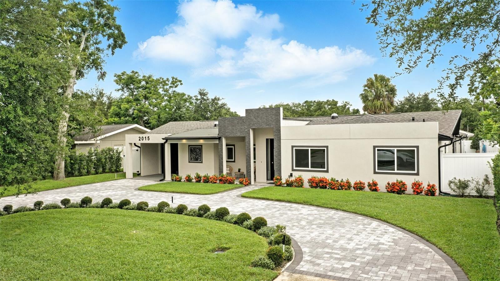 In the heart of Kenilworth Shores, one of Winter Park’s desirable neighborhoods, this completely renovated one-story residence offers a blend of modern luxury and effortless livability. Meticulously reimagined in 2024, every detail of this home has been thoughtfully curated—from the clean-lined architectural finishes to the flowing, open-concept layout that seamlessly connects indoor and outdoor living. The all-new designer kitchen serves as the heart of the home, featuring sleek top-of-the-line Bosch appliances with an induction range, an oversized island with seating, quartz countertops, an 8-by-4-foot walk-in pantry, and a stylish wet bar with wine refrigeration. Overlooking the spacious dining area and great room, the kitchen is ideal for everyday living and effortless entertaining. Wide sliding glass doors open to a covered lanai that extends the living space outdoors, complete with lounge and dining areas, a sparkling 28-by-14-foot pool (depth is 3 feet to 5 feet) and a fully outfitted summer kitchen with built-in grill, sink, storage and refrigeration, creating your private retreat. The privately situated primary suite is a luxurious haven, offering a spa-like bath with double vanities, a walk-in shower (all baths have Delta Ara showerheads), soaking tub and an expansive custom walk-in closet. A thoughtful addition, the suite’s breakfast bar with a beverage refrigerator adds hotel-style comfort, while sliding glass doors provide direct access to the pool and outdoor lounge area. Three additional bedrooms offer flexible living arrangements, including one with a walk-in closet and en-suite bath, ideal for guests or multigenerational living. A versatile flex room—ideal for a media room, fitness studio, playroom or home theater—adds to the home’s appeal, along with a designated office and a full pool bath. Additional features include a spacious laundry room with custom cabinetry, beautiful contemporary lighting and hardware selections, and professionally landscaped grounds enhanced by accent lighting in the front and rear. A circular driveway and modern curb appeal elevate the home’s presence, while the location places you just a short distance from Winter Park High School and minutes from top-rated elementary and middle schools. Enjoy proximity to the boutique shopping and fine dining of Park Avenue, the vibrant energy of Baldwin Park, Rollins College, Full Sail University and convenient access to Orlando International Airport. With its stunning renovation, thoughtful layout and prime location, this home is a gem in the heart of Winter Park. Upgrades include but are not limited to Nest thermostats, a 5-ton air-conditioning unit, alarm system with sensors at all openings, pre-wired outdoor speakers, LED lights with dimmers, high-end Delta faucets and showerheads, smart water heater, smart outdoor lighting, variable speed pool pump and leaf filters on gutter system. This home was a complete renovation of a 1957 home with effective year built date of 2024.
