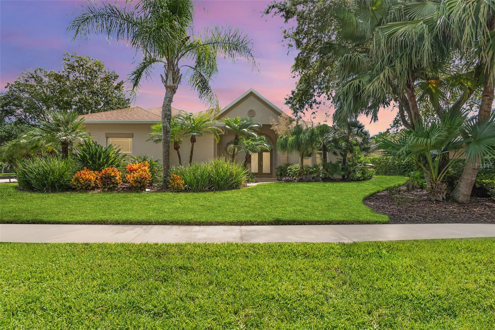 One or more photo(s) has been virtually staged. - furniture only. Welcome to this meticulously maintained custom home designed by renowned builder Peter Solti. Nestled on a cul-de-sac in sought-after Halifax Plantation, this residence blends timeless elegance with modern luxury in a setting that perfectly balances recreation, relaxation & privacy. You'll appreciate the impeccable curb appeal, professionally landscaped grounds offering privacy & beauty on a generous 100 x 125 lot. Step inside the double glass doors and feel the quality—from the soaring ceilings to the 8' doors, sliders, crown molding & plantation shutters in all bedrooms. The transitional design seamlessly blends classic & contemporary elements for a stylish & welcoming feeling. The split floor plan ensures privacy, with the primary suite and office/bedroom located on one side of the home, and two guest bedrooms on the other. The primary suite is exceptional in scale & comfort, measuring 18 x 16 and offering private access to the lanai & pool. It features two oversized walk-in closets with custom built-ins, and a spa-inspired primary bath with a double door entry, granite-topped vanities with dual sinks, a separate walk-in shower, garden tub & water closet. This home features 2.5 bathrooms, including a well appointed guest bath doubling as a pool bath. With a granite counter, tub/shower combination & direct door to the lanai, it offers convenience and function for outdoor entertaining. At the heart of the home the eat-in kitchen features modern cabinetry, stainless appliances, granite counters & and a walk-in pantry. A spacious breakfast bar connects the kitchen to the family room, creating an effortless flow for entertaining. Step through the French doors from the formal dining room to a charming courtyard, perfect for al fresco meals. The adjacent living room features sliding glass doors opening to the lanai, allowing seamless indoor-outdoor access from the family room and living room. Host with ease on the 20 x 22 covered lanai, which overlooks the stunning custom pool with a travertine deck and Paramount ClearO3 Ozone Pool Water Clarifier, designed for superior water quality and extended equipment life. Whether enjoying a morning coffee or evening cocktail, this outdoor space offers peace and elegance year-round. Additional upgrades include a new roof (2021), custom pool installation (2018), coffered and tray ceilings, 2023 hybrid hot water heater, double-pane windows, and a 25.7 x 22.5 garage spacious enough for your golf cart and more. The inside laundry room is both functional and beautiful, featuring cabinetry with built-in sink. Located in Halifax Plantation, homeowners enjoy a resort-style lifestyle with optional golf, tennis, fitness, and social memberships available at affordable rates. Enjoy exceptional cuisine without a membership at country club restaurant just a short golf cart ride from the home. The community is just minutes from state parks, scenic trails & beaches. With its premium location, expansive driveway, full irrigation system with well, gutters around the entire home and pool enclosure, and move-in ready condition, this home offers a rare opportunity to enjoy luxury living in one of the area's most desirable communities. Please note: Seller currently building another home, expected to be ready on or before end of October. Seller is open to an earlier closing with a lease-back agreement, offering flexibility for the right buyer.