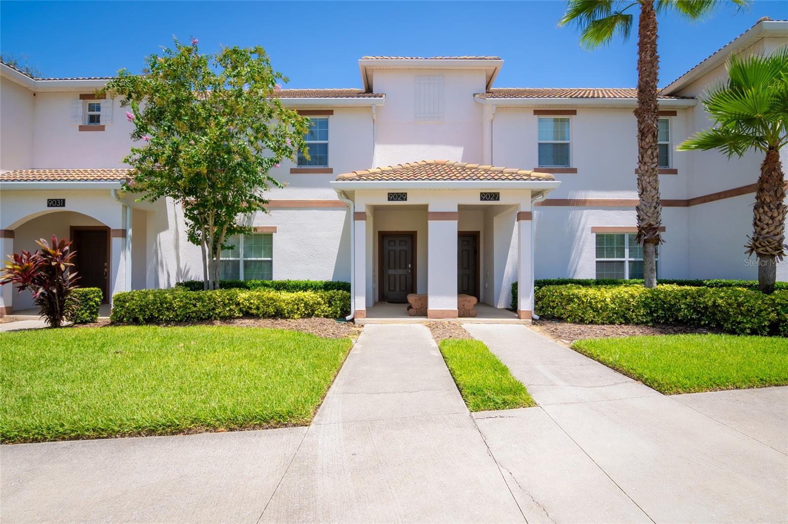 Welcome to your dream vacation rental in the heart of Champions Gate’s most sought-after community—The Retreat. This fully furnished 4-bedroom, 3-bathroom townhome is not only packed with upgrades and style, but it's also just 20 minutes from the magic of Walt Disney World, making it a favorite among travelers from around the world. The open-concept layout features a modern kitchen with granite countertops, stainless steel appliances, and a large island perfect for prepping meals or gathering with guests. The dining area comfortably seats eight, and the spacious living room opens directly to a private, screened-in pool and patio—ideal for relaxing, dining outdoors, or enjoying the Florida sunshine. A bedroom and full bathroom on the first floor provide added flexibility, while upstairs you’ll find two themed bedrooms—one inspired by the Minions and the other by the Avengers—both outfitted with bunk beds and designed to impress. The primary suite offers its own ensuite bathroom, and each bedroom is equipped with a TV for added comfort and entertainment. Located in a secure, guard-gated golf course community, this property includes access to the Oasis Club, offering resort-style amenities such as a large pool, splash pad, spa, fitness center, game room, movie theatre, tennis courts, and on-site dining. The community features beautifully maintained landscaping, walkable sidewalks, and plenty of parking for guests. All furnishings convey with the sale, and the property has a strong history as a vacation rental with solid bookings in place through the remainder of 2025. Rental reports for the past four years are available upon request. Whether you're seeking a high-performing investment property or a fully equipped vacation retreat, this home checks all the boxes.
